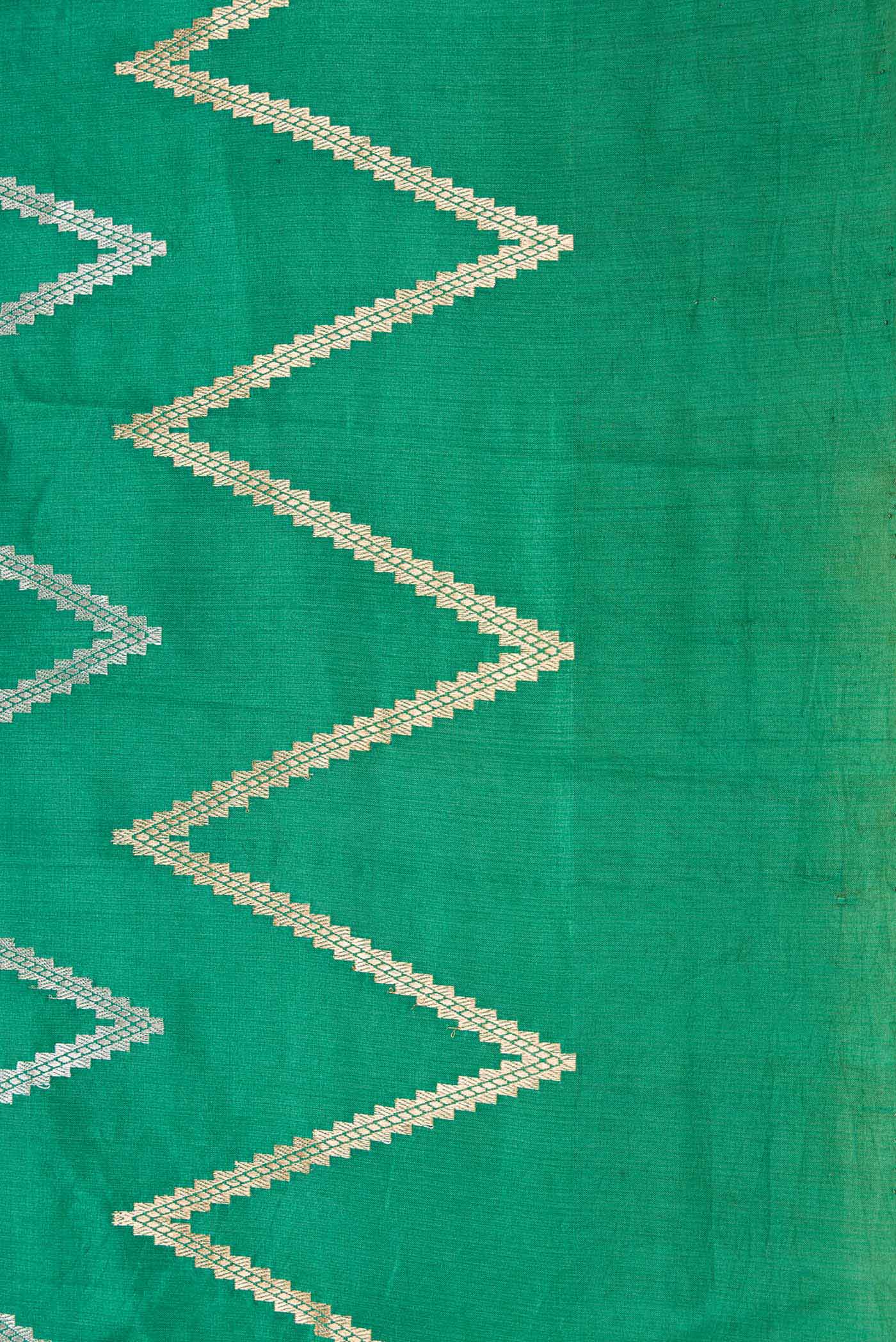 Border image of Green and Sandal Color Tussar Silk Saree with Zari Butta on the body and Plain Border
