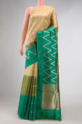 Green and Sandal Color Tussar Silk Saree with Zari Butta on the body and Plain Border displayed on a mannequin