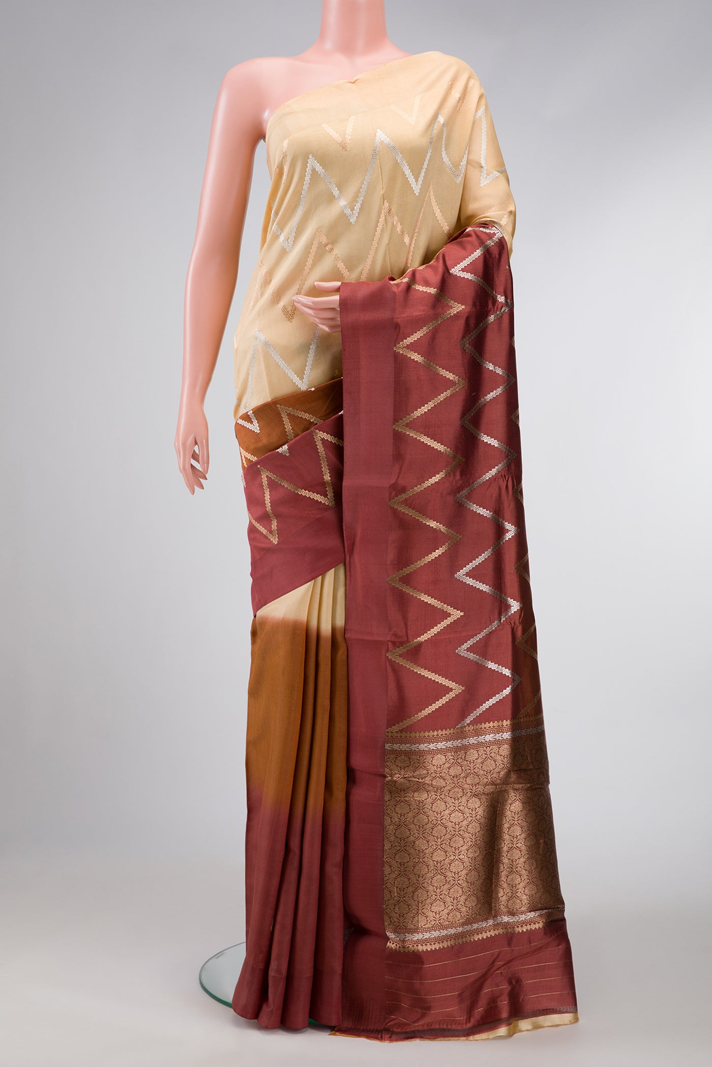 Brown and Beige Color Tussar Silk Saree with Stripes on the body and Plain Border.  displayed on a mannequin