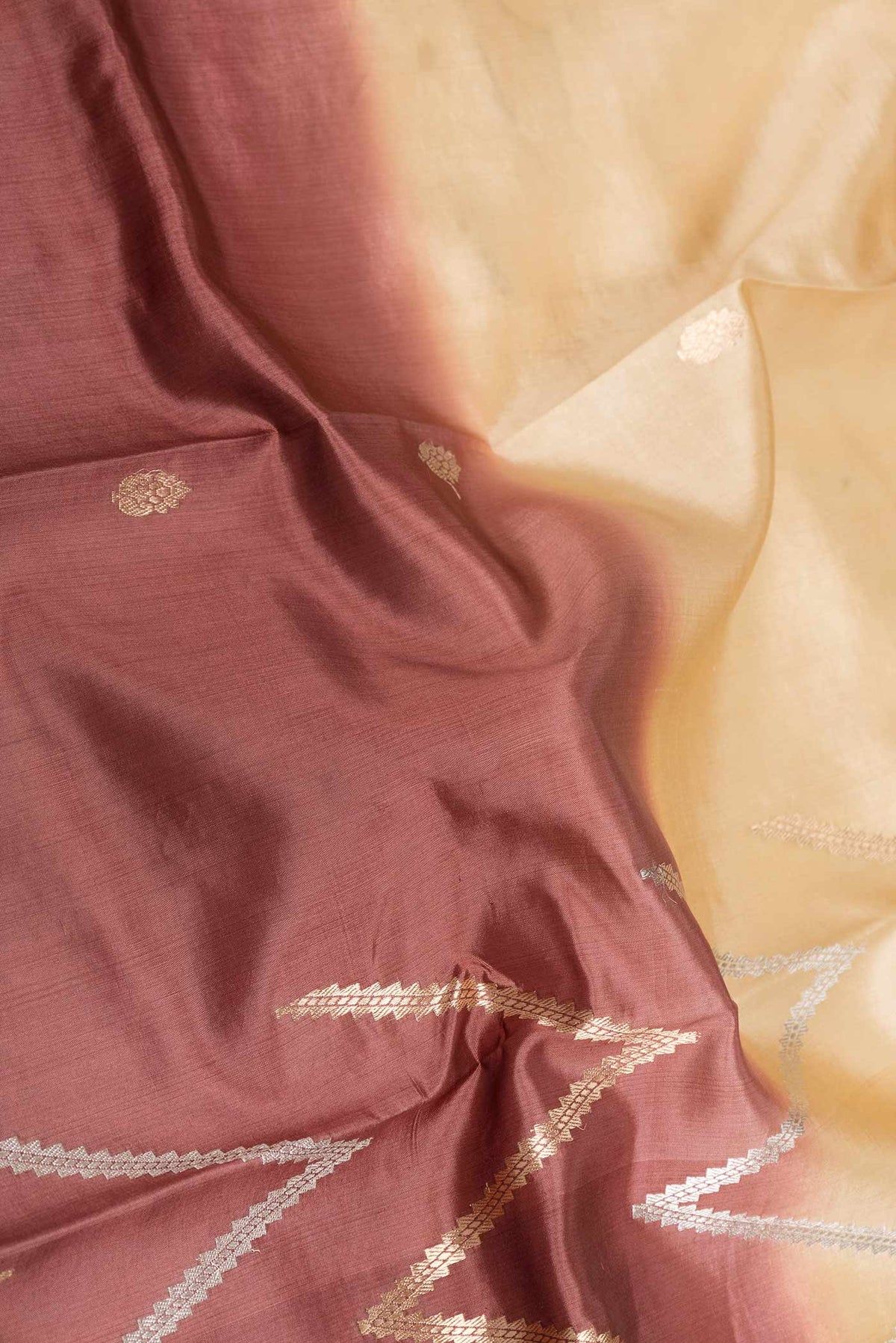 Close up of Multi Color Tussar Saree with Zari Brocade on the body and Plain Border displaying folds