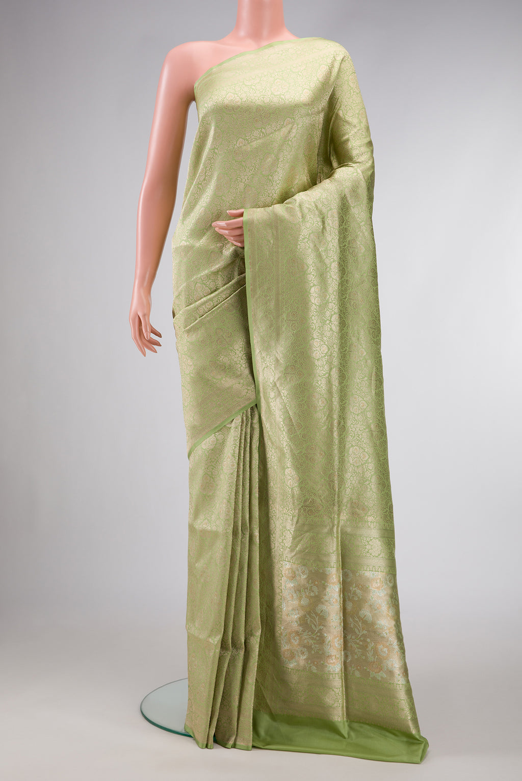 Pista Green Dual Tone Banarasi Silk Saree with Zari Brocade on the body and Zari Border.  displayed on a mannequin