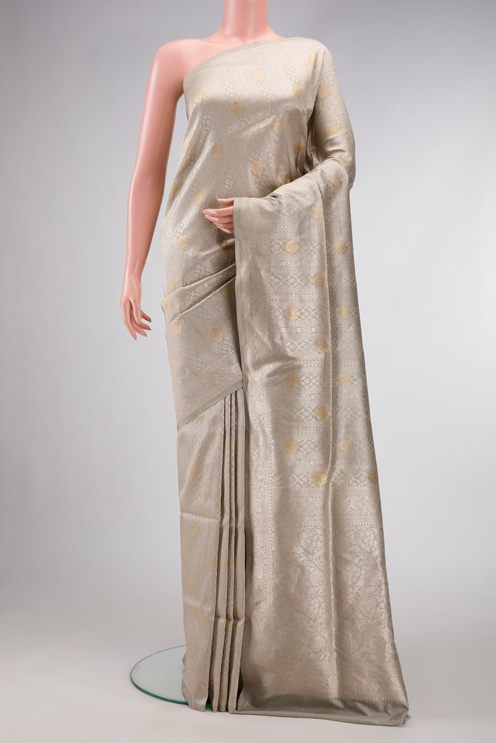 Grey Dual Tone Banarasi Silk Saree with Zari Brocade on the body and Zari Border.  displayed on a mannequin