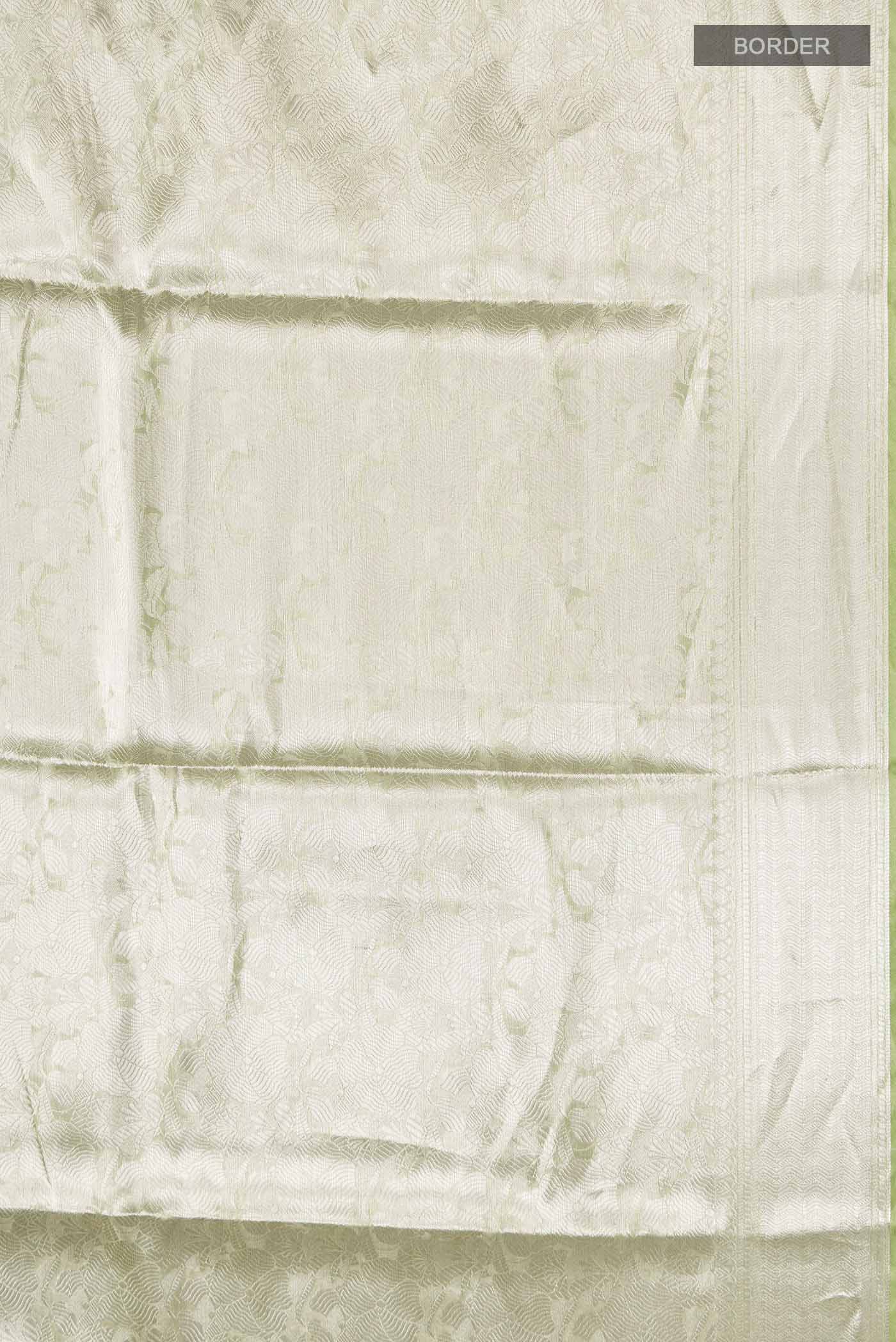 Border image of Green Tissue Silk Saree with Zari Brocade on the body and Zari Border
