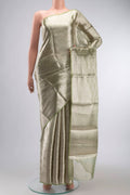 Green Tissue Silk Saree with Zari Brocade on the body and Zari Border displayed on a mannequin