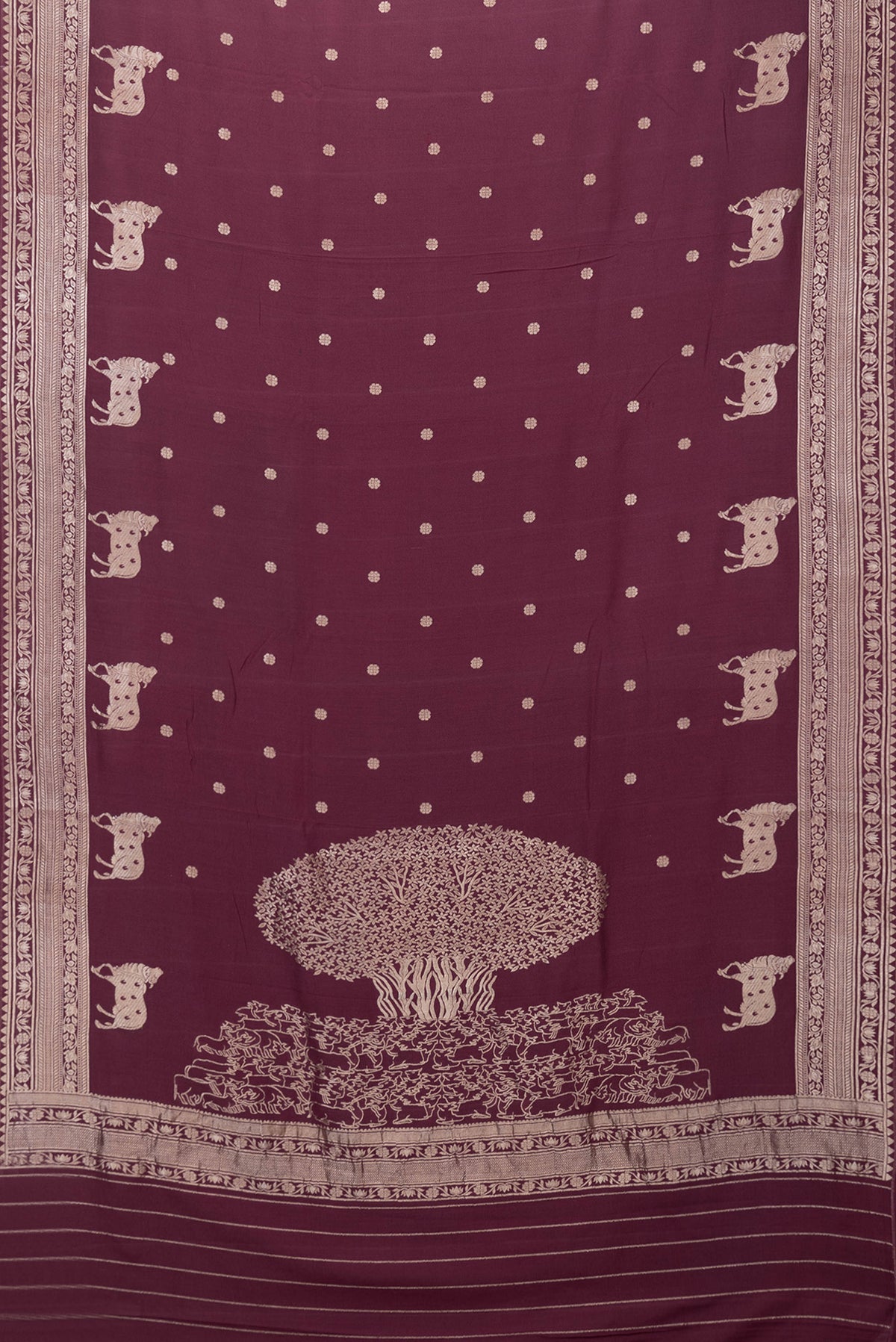 Flat view of Maroon Dual Tone Tussar Silk Saree with Zari Butta on the body and Zari Border. 