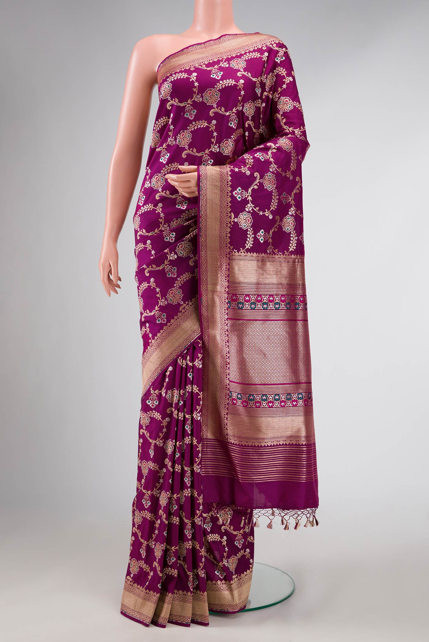 Magenta Dual Tone Banarasi Silk Saree with Zari And Thread Butta on the body and Zari Border displayed on a mannequin