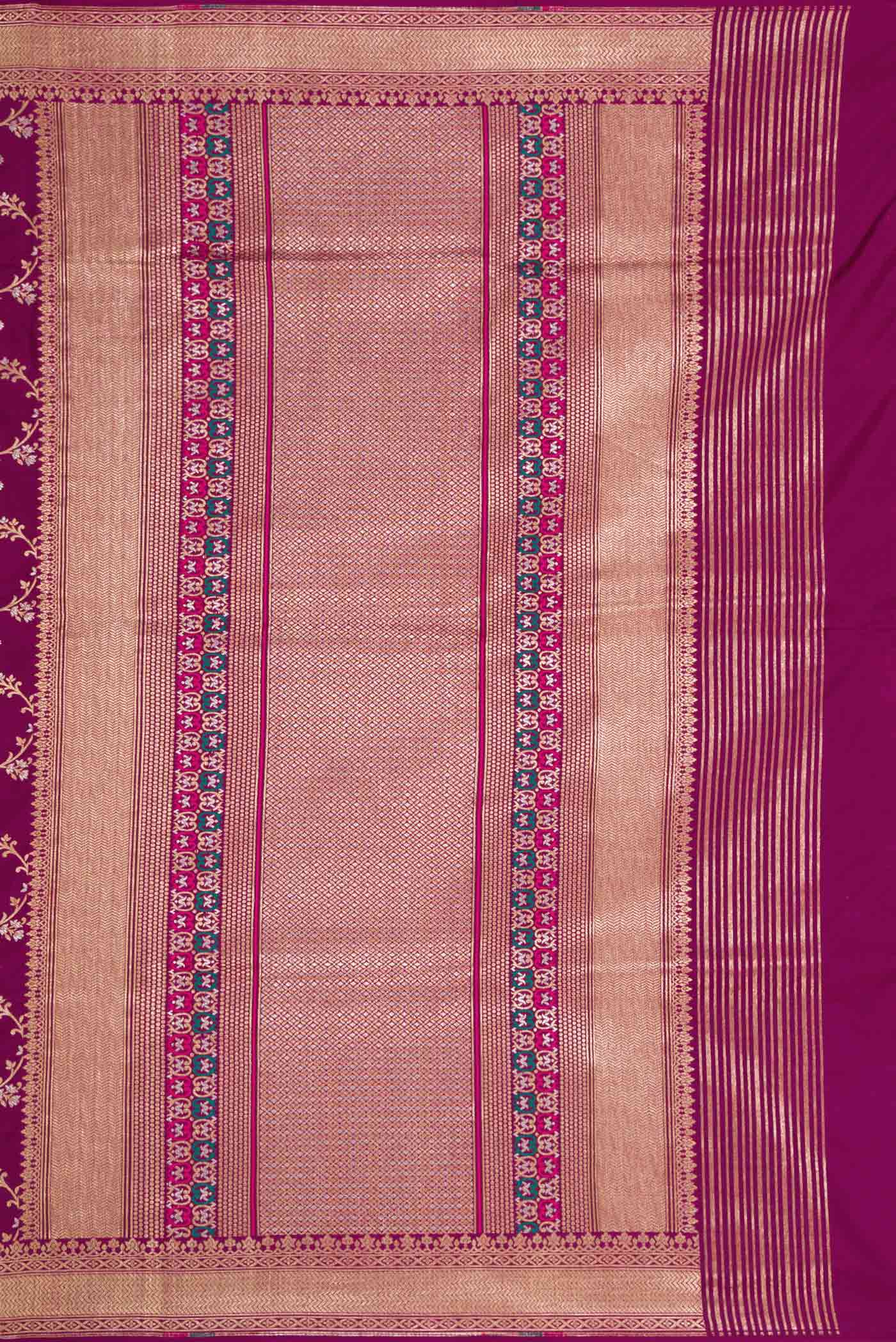 Close up image of the pallu of Magenta Dual Tone Banarasi Silk Saree with Zari And Thread Butta on the body and Zari Border