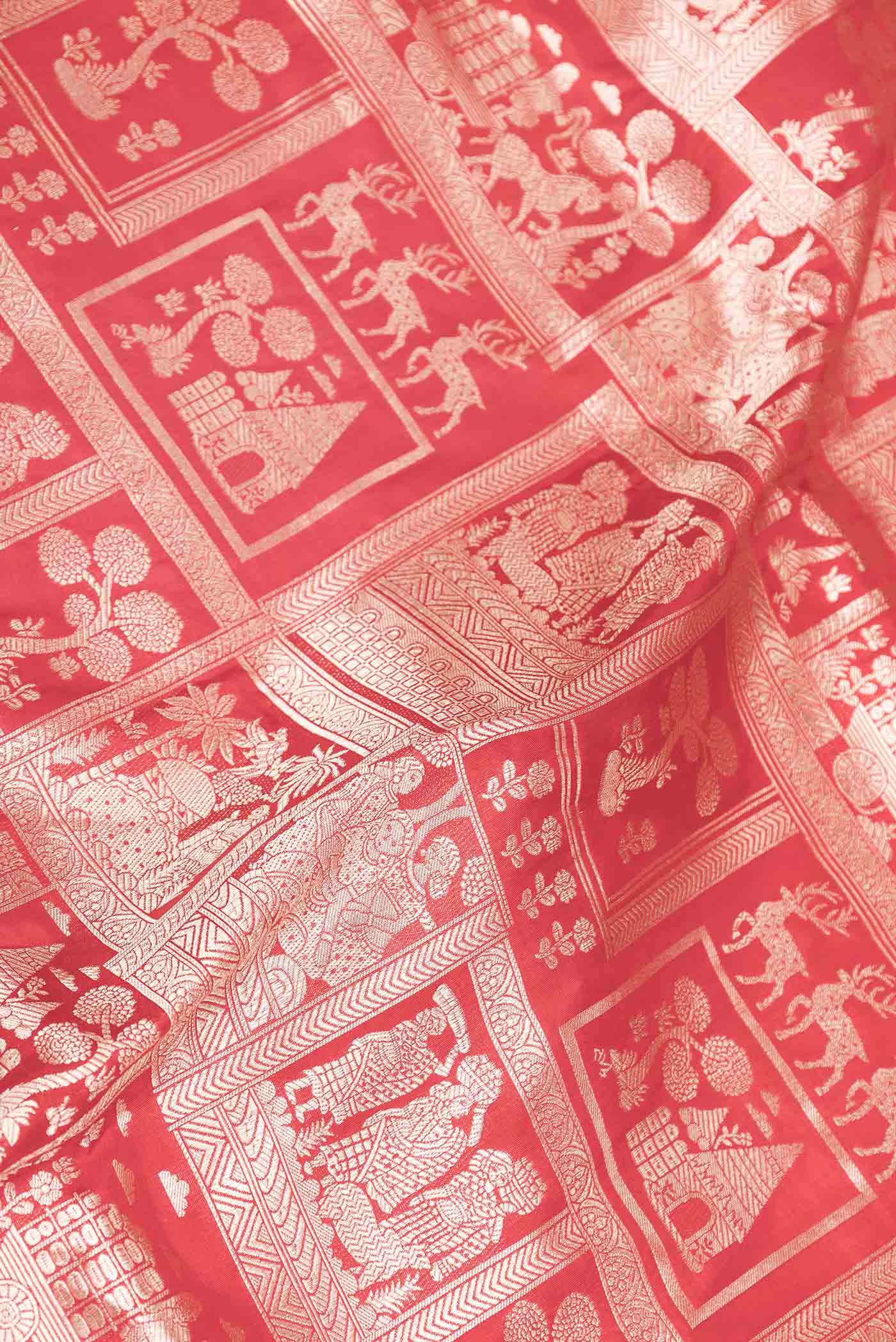 Close up of Red Dual Tone Banarasi Saree with Zari Brocade on the body and Zari Border displaying folds