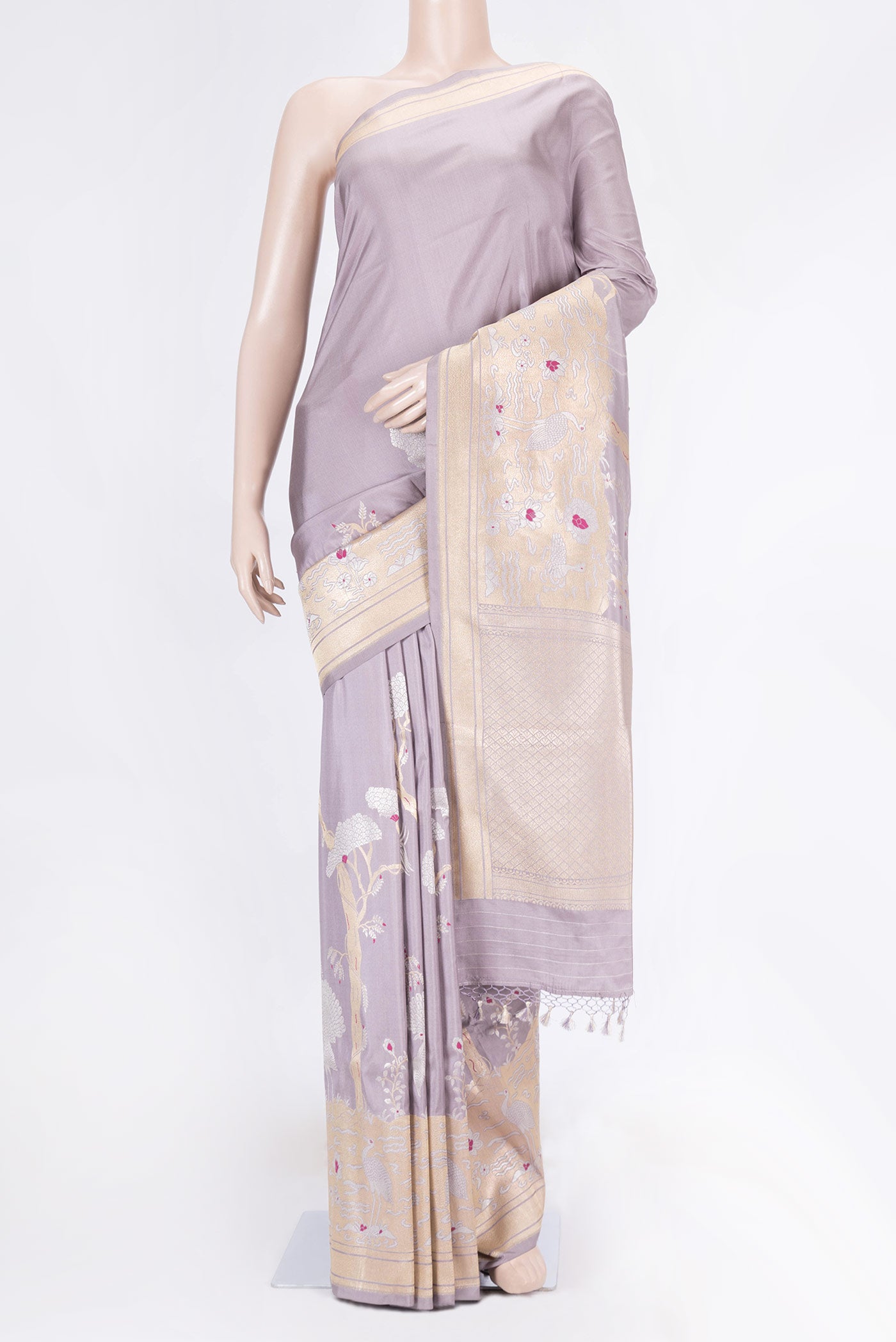 Lavender Dual Tone Banarasi Saree with Zari Butta on the body and Fancy Border displayed on a mannequin