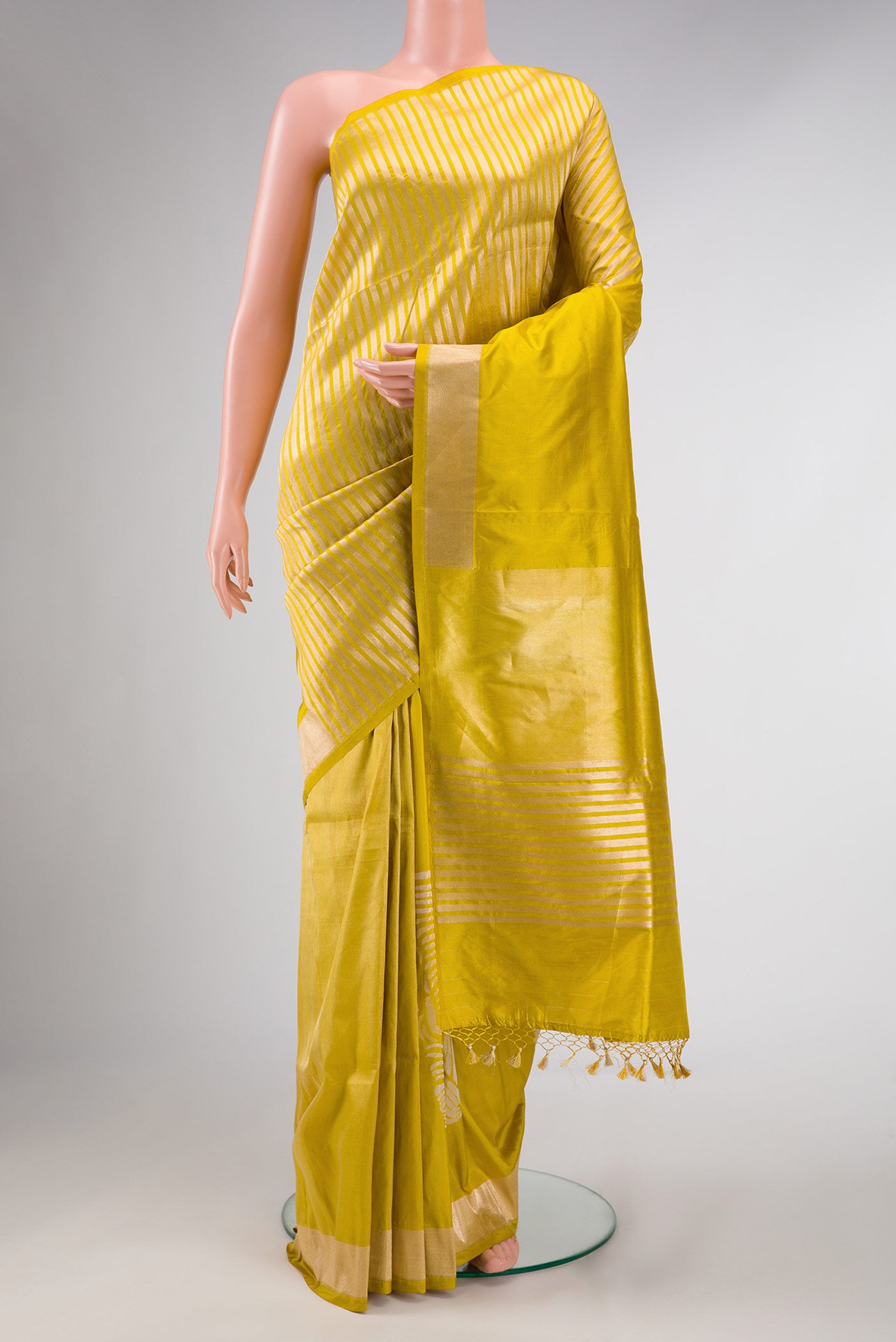 Mehandi Green Dual Tone Banarasi Silk Saree with Zari Butta on the body and Fancy Border displayed on a mannequin