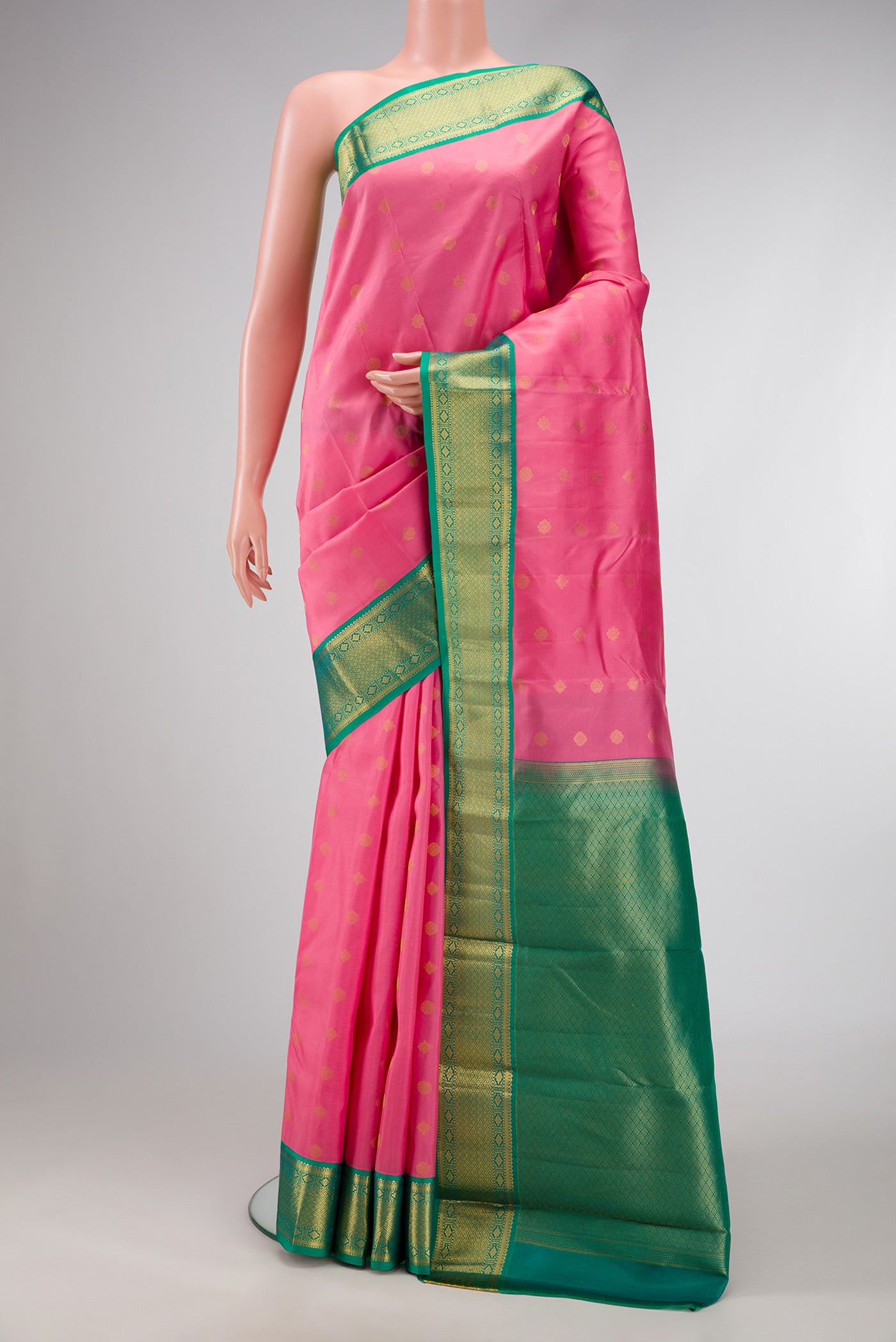 Pink Dual Tone Kanchipuram Silk Saree with Zari Butta on the body and Zari Border.  displayed on a mannequin