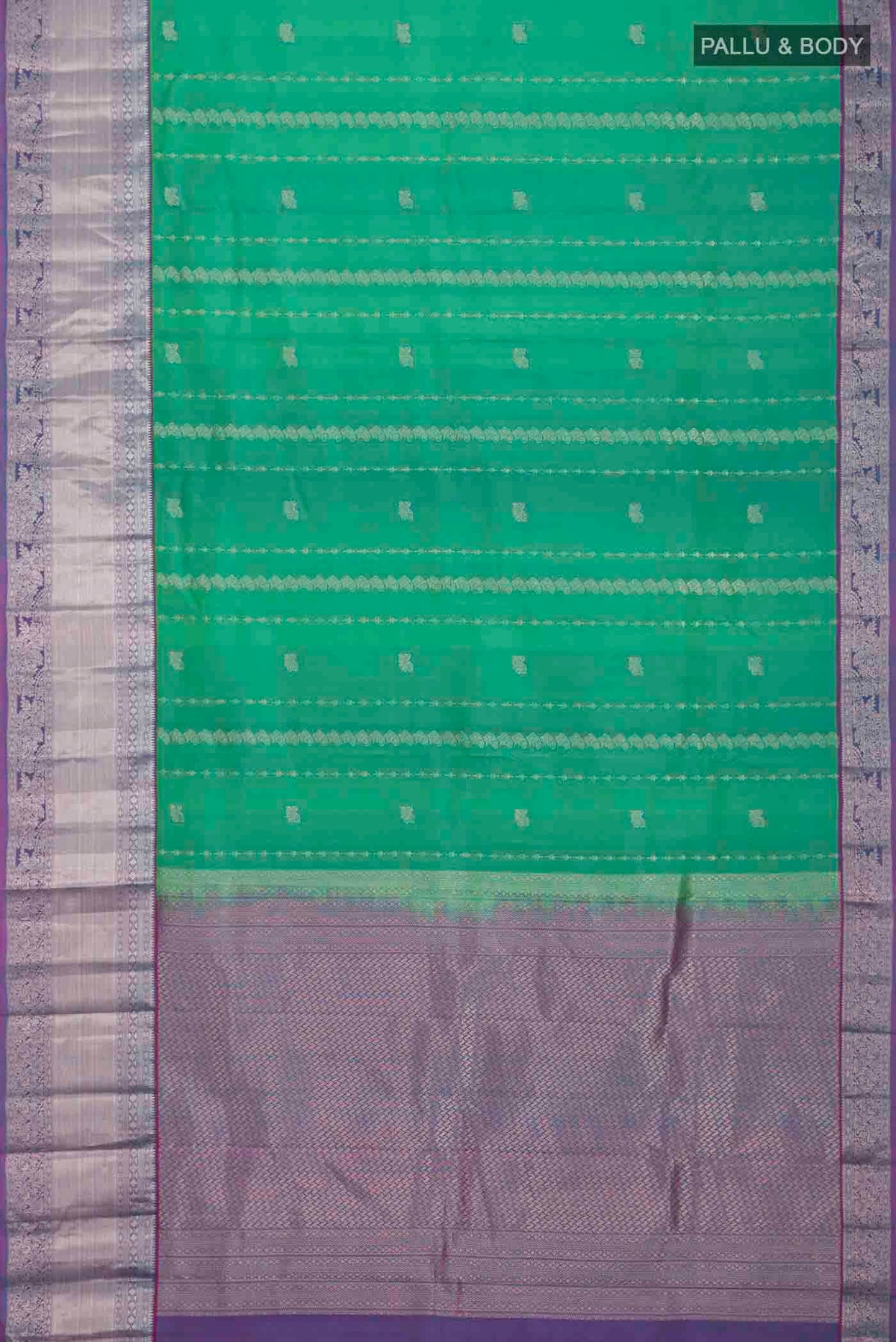 Flat view of Green Kanchipuram Silk Saree with Zari Butta on the body and Zari Border
