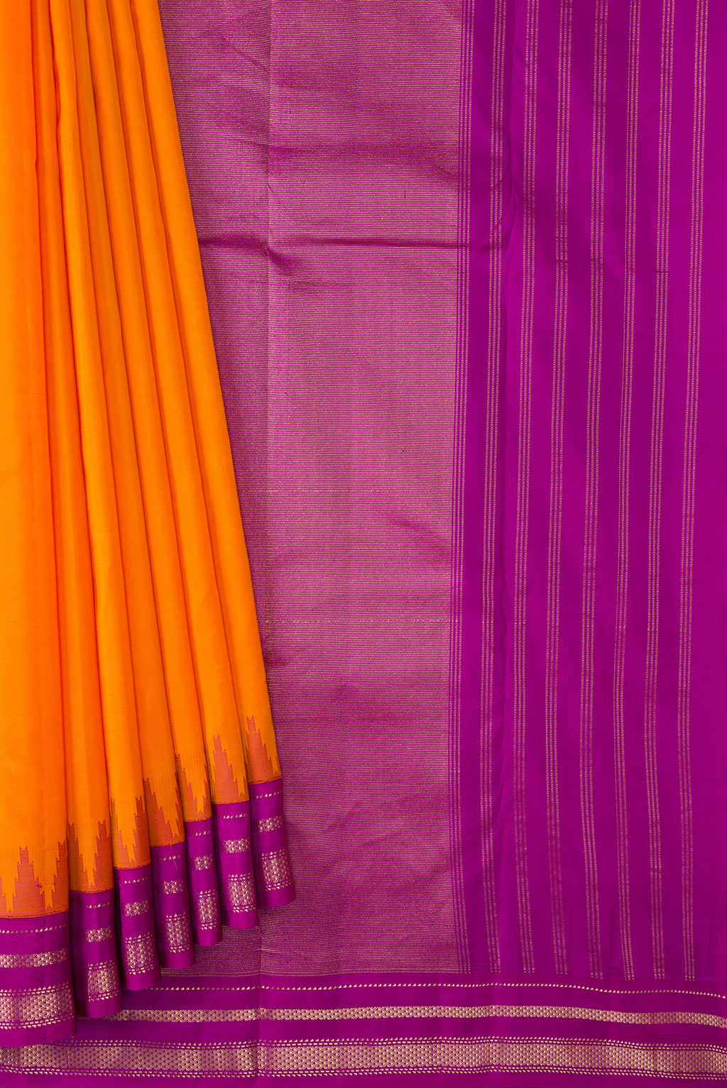 Pleats and pallu of Orange Dual Tone Kanchipuram Silk Saree with Plain Body and Ganga Jamuna Border. 