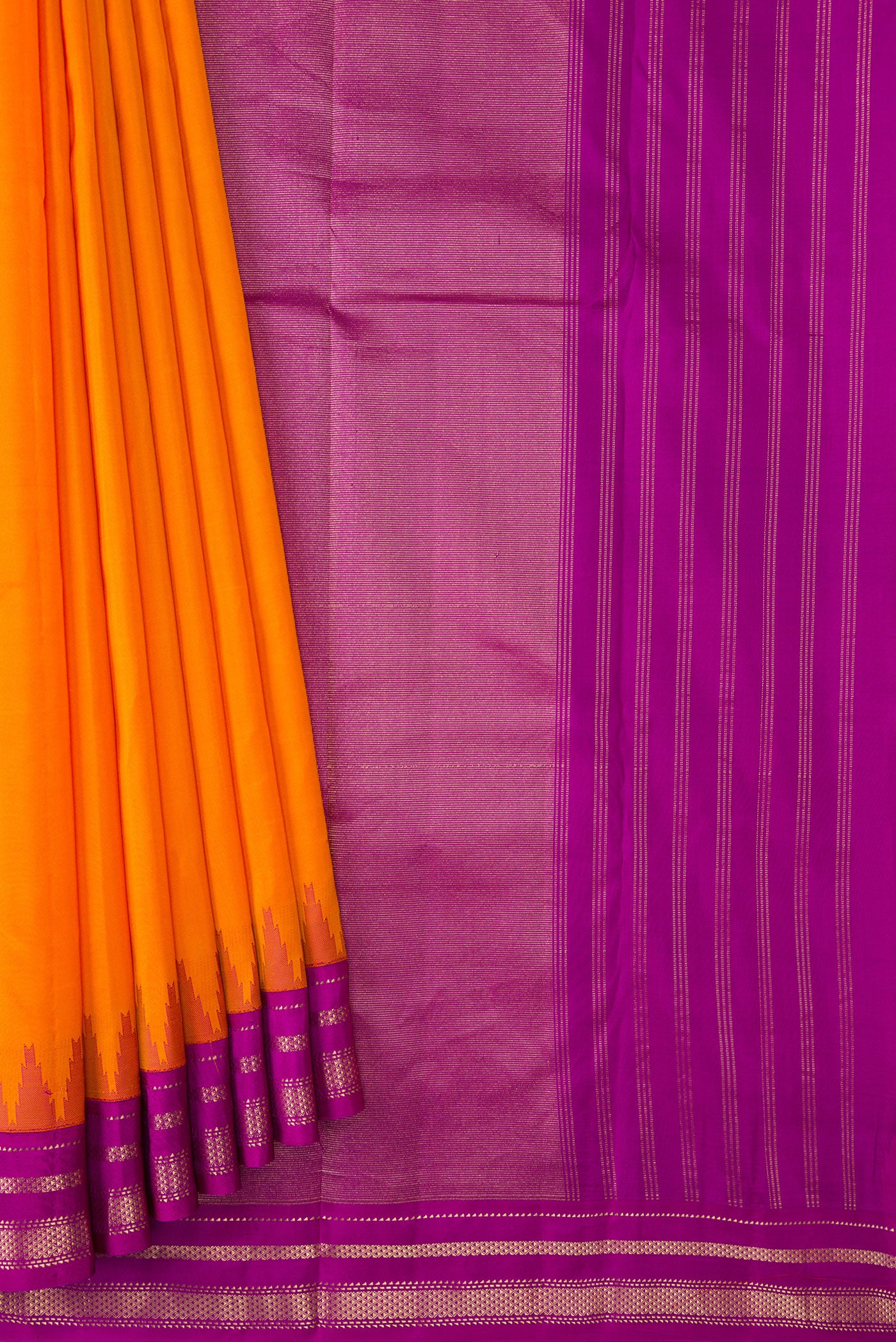 Pleats and pallu of Orange Dual Tone Kanchipuram Silk Saree with Plain Body and Ganga Jamuna Border. 