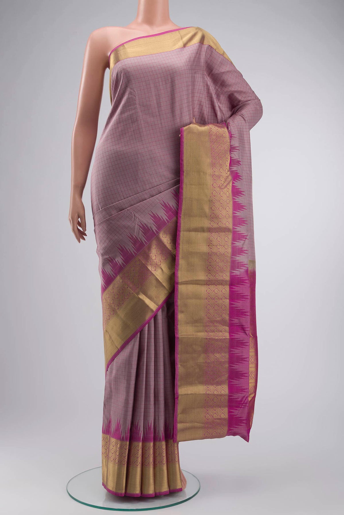 Mauve Kanchipuram Silk Saree with Checked design on the body and Zari Border displayed on a mannequin