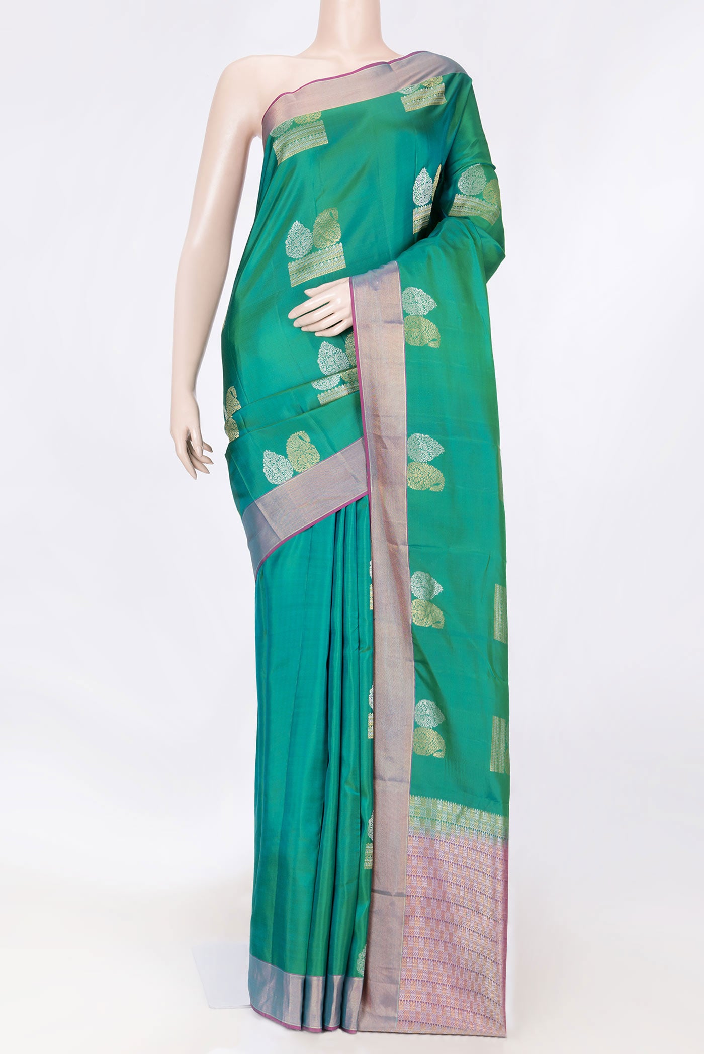 Green Dual Tone Kanchipuram Saree with Zari Butta on the body and Zari Border displayed on a mannequin