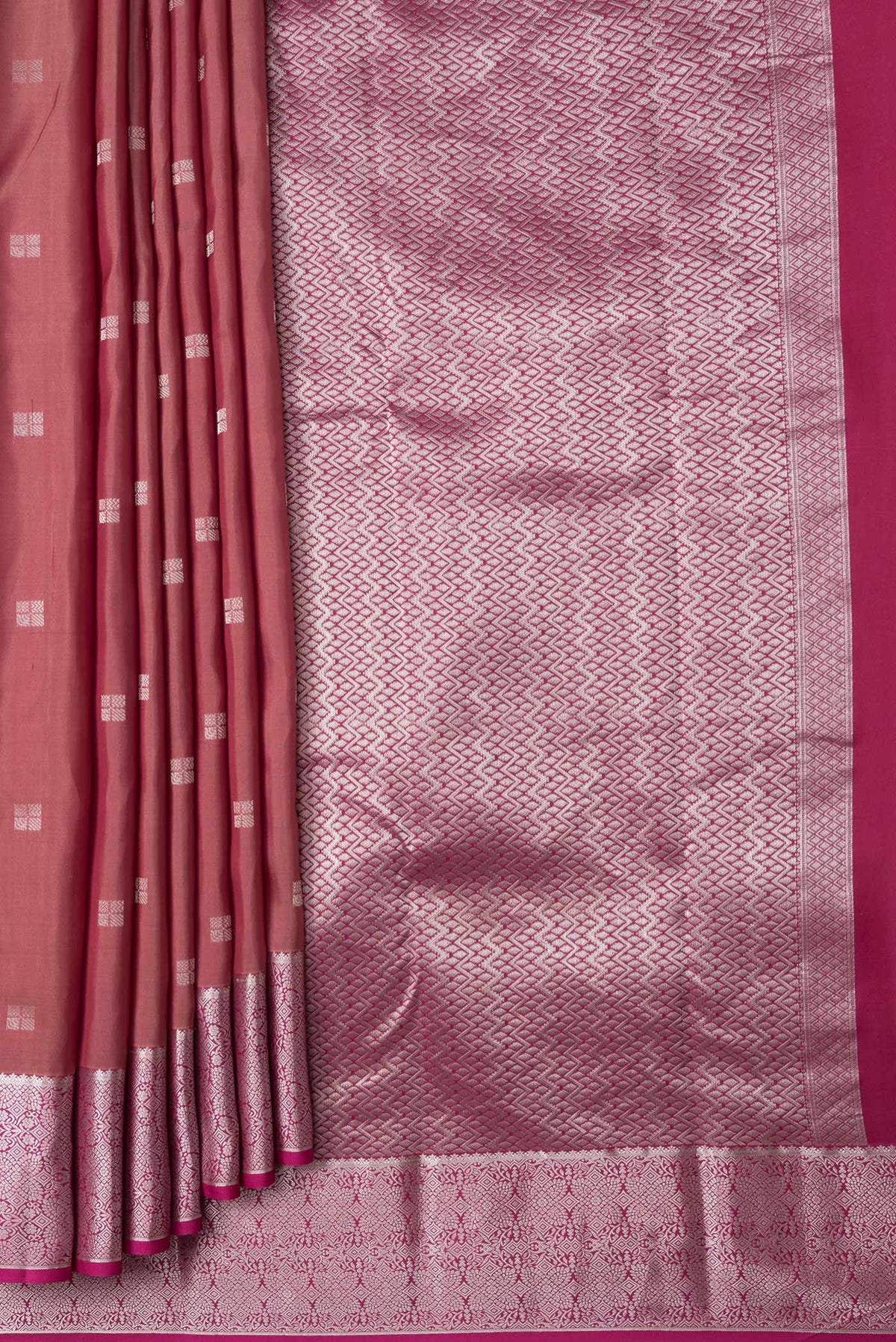 Pleats and pallu of Brown Dual Tone Kanchipuram Silk Saree with Zari Butta on the body and Zari Border. 