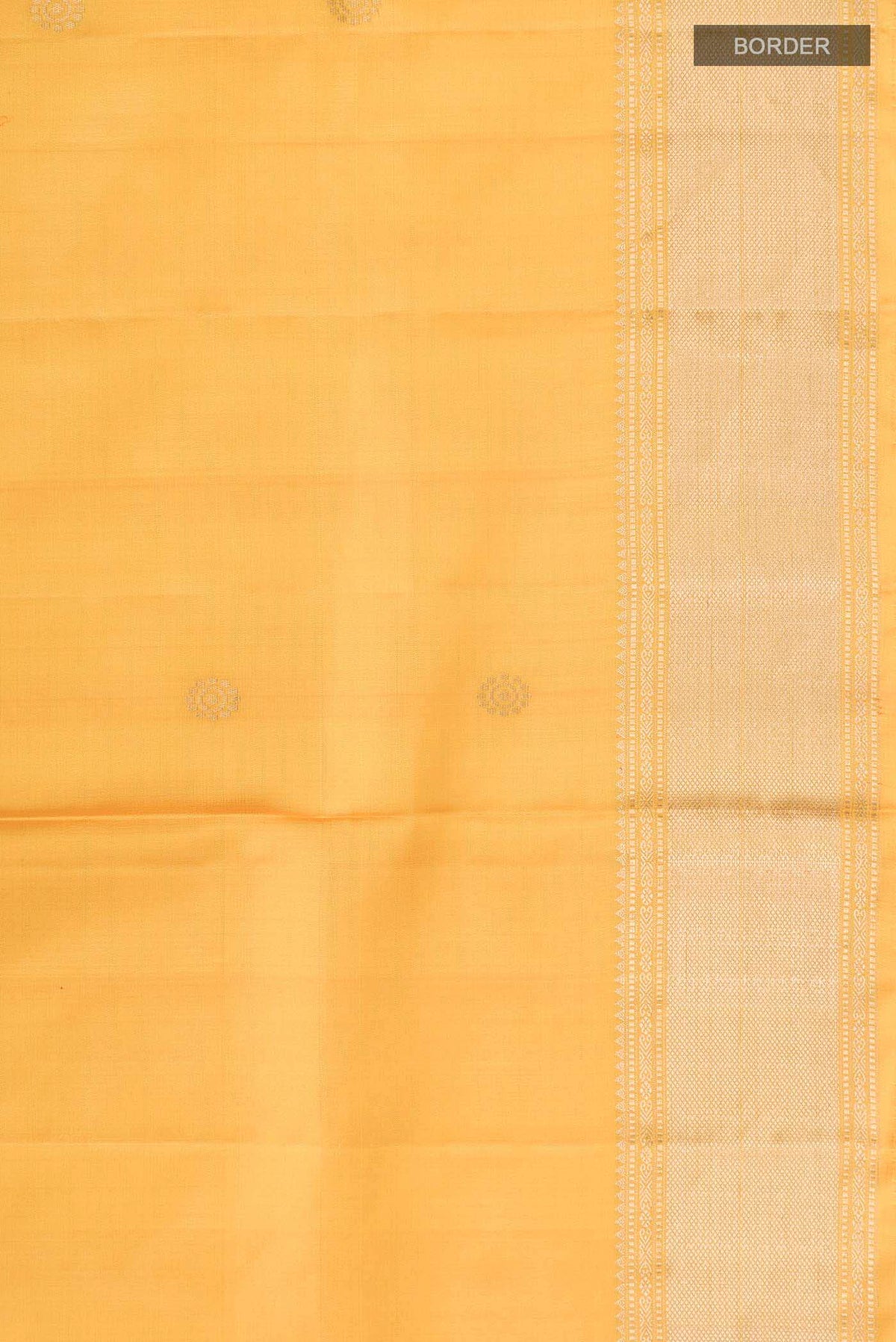Border image of Yellow Soft Silk Saree with Zari Butta on the body and Zari Border