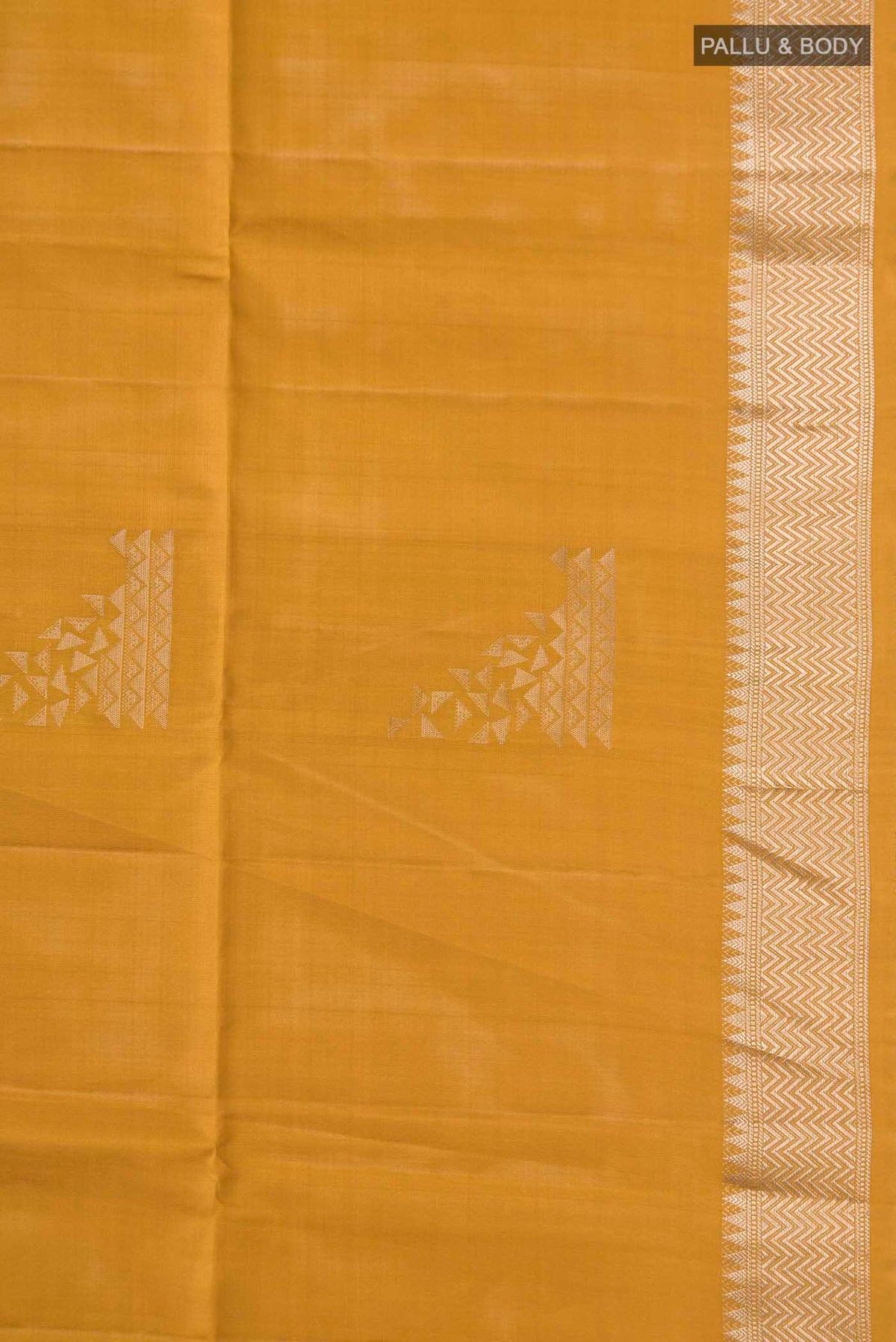 Border image of Mustard Soft Silk Saree with Zari Butta on the body and Zari Border