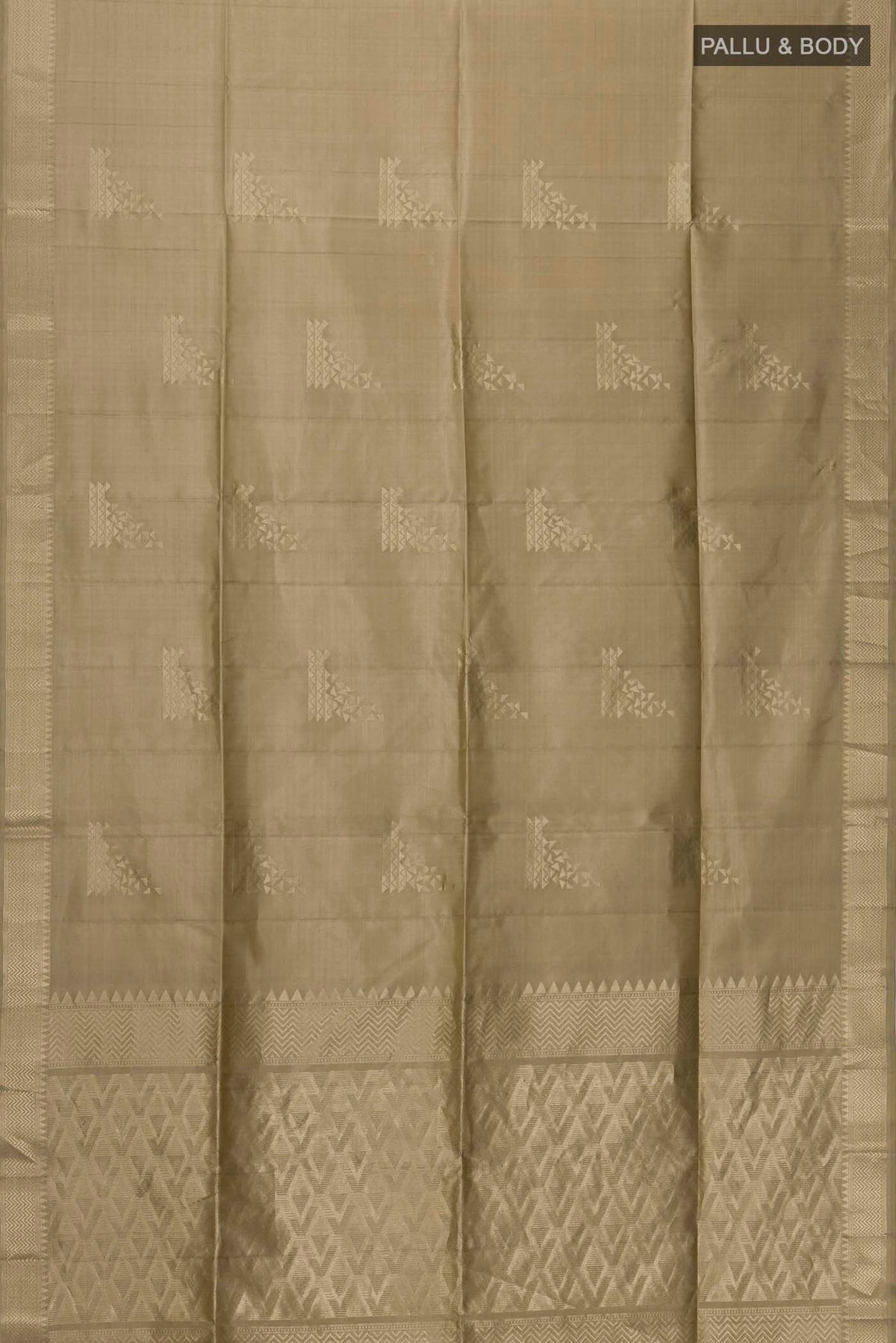 Flat view of Beige Soft Silk Saree with Zari Butta on the body and Zari Border