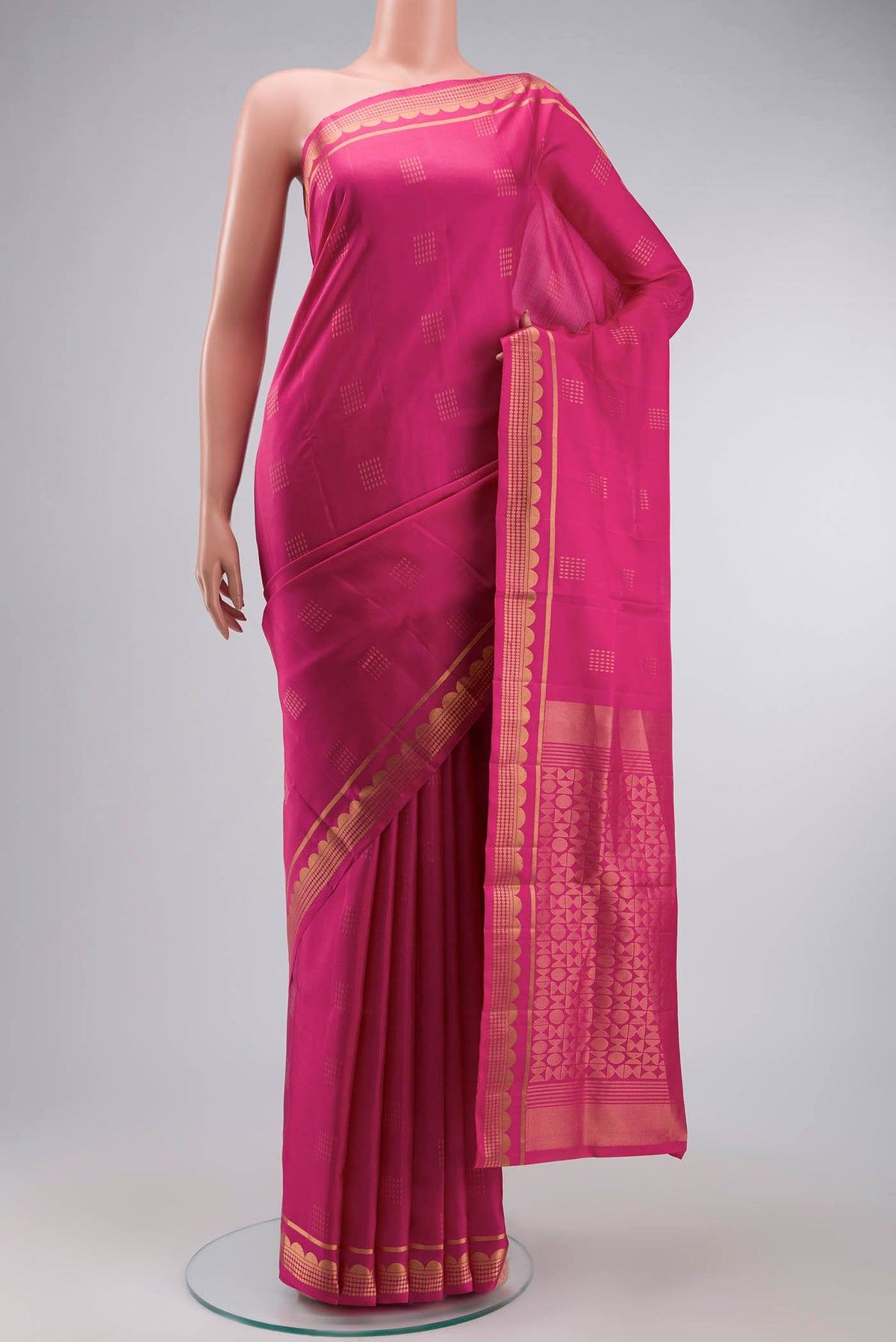 Pink Soft Silk Saree with Zari Butta on the body and Zari Border displayed on a mannequin