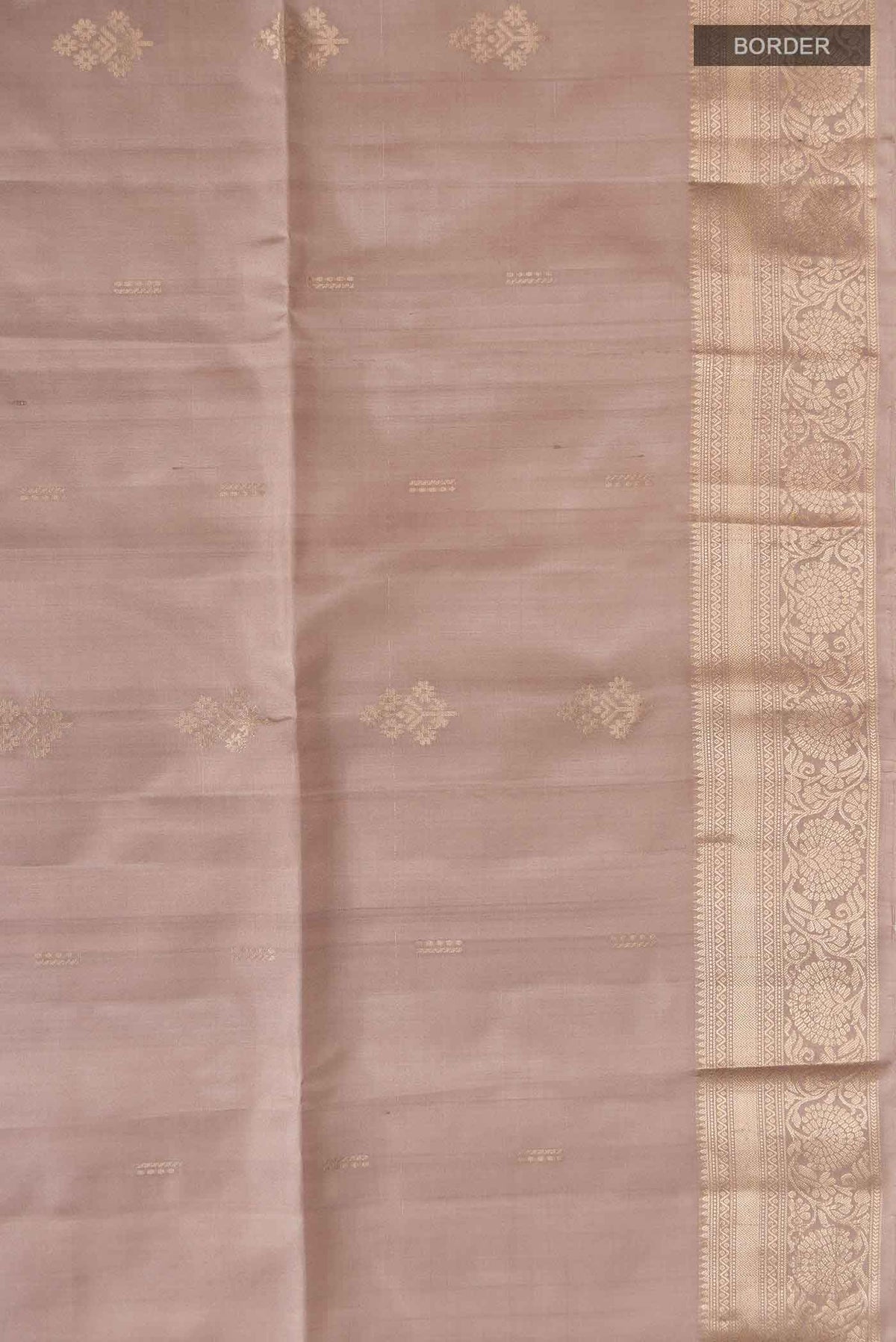 Border image of Grey Soft Silk Saree with Zari Butta on the body and Zari Border
