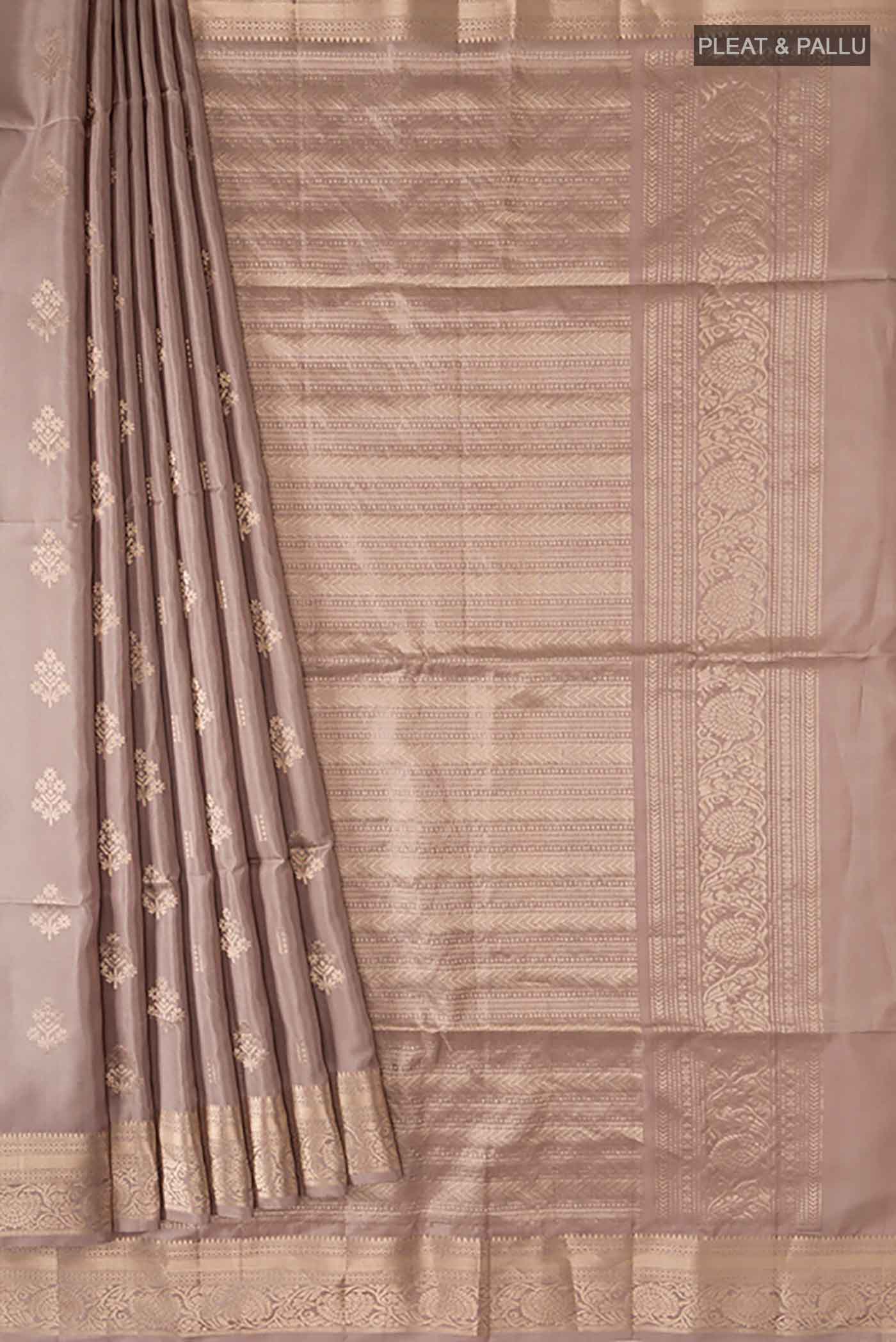 Pleats and pallu of Grey Soft Silk Saree with Zari Butta on the body and Zari Border