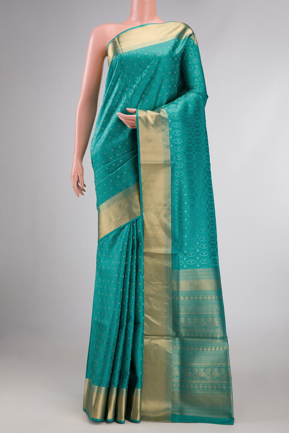 Sea Green Dual Tone Soft Silk Saree with Jacquard With Zari Butta on the body and Zari Border displayed on a mannequin