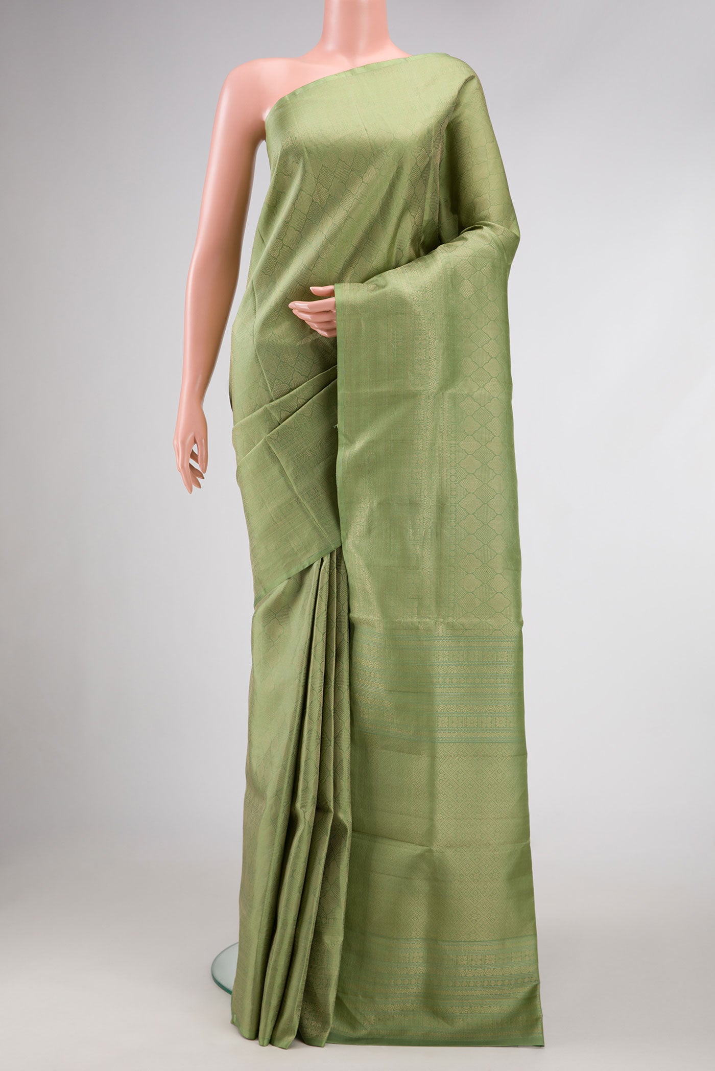 Pista Green Dual Tone Soft Silk Saree with Zari Brocade on the body and Zari Border.  displayed on a mannequin