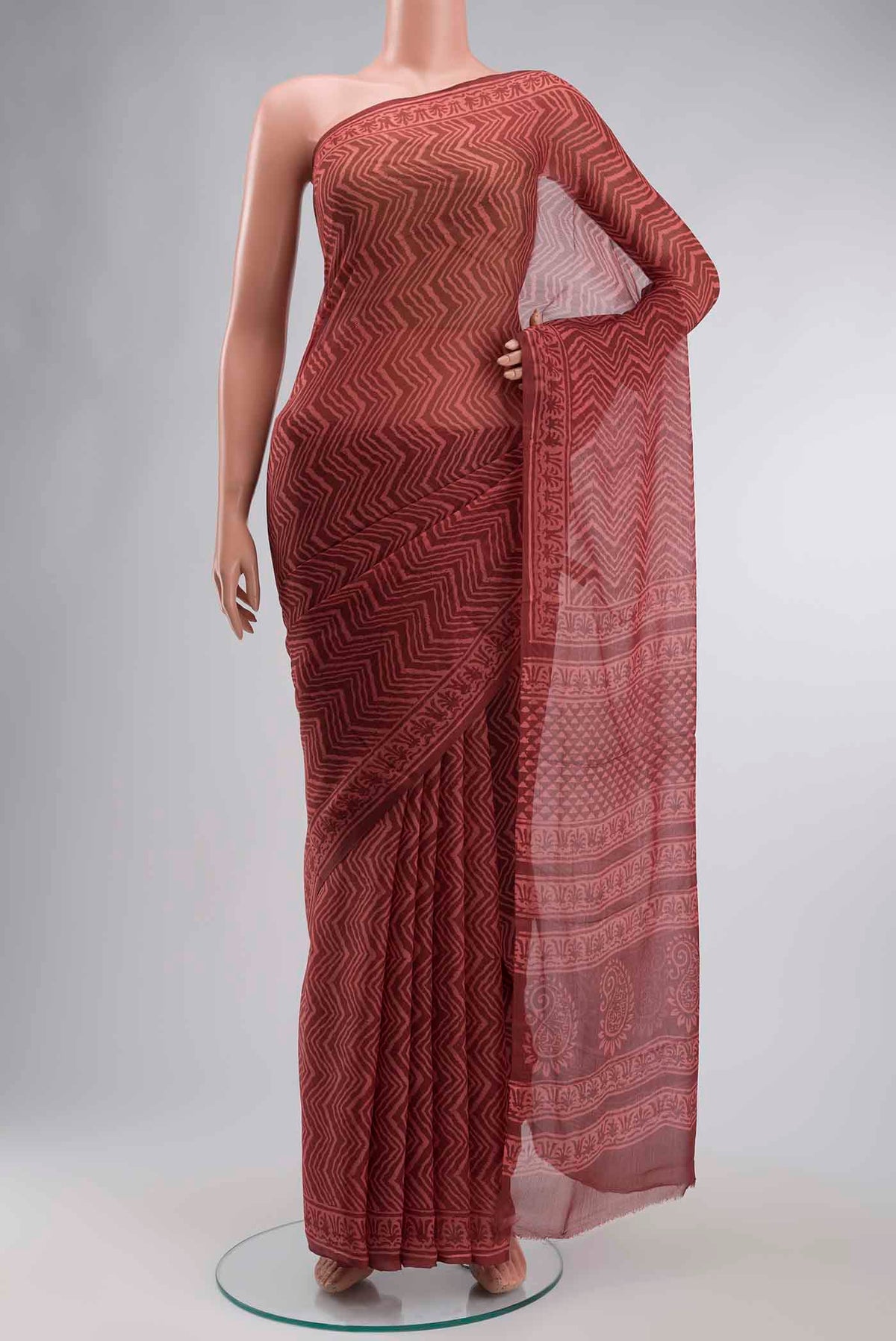 Bronze Mysore Chiffon Saree with Printed design on the body and Plain Border displayed on a mannequin