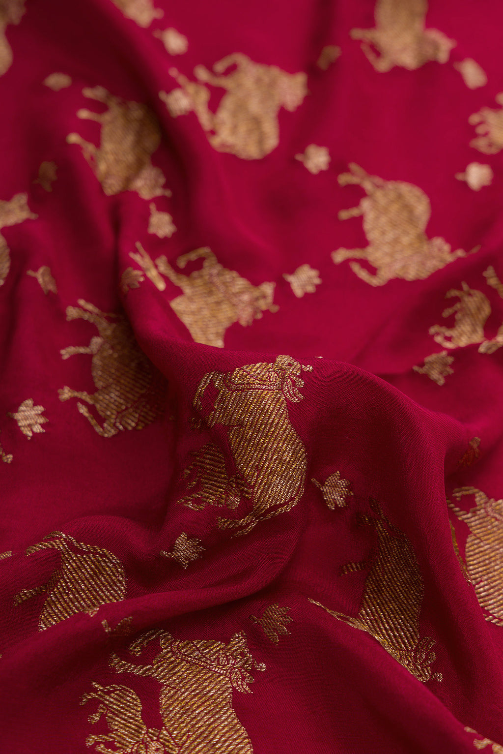 Close up of Maroon Dual Tone Banarasi Georgette Saree with Zari Brocade on the body and Fancy Border.  displaying folds