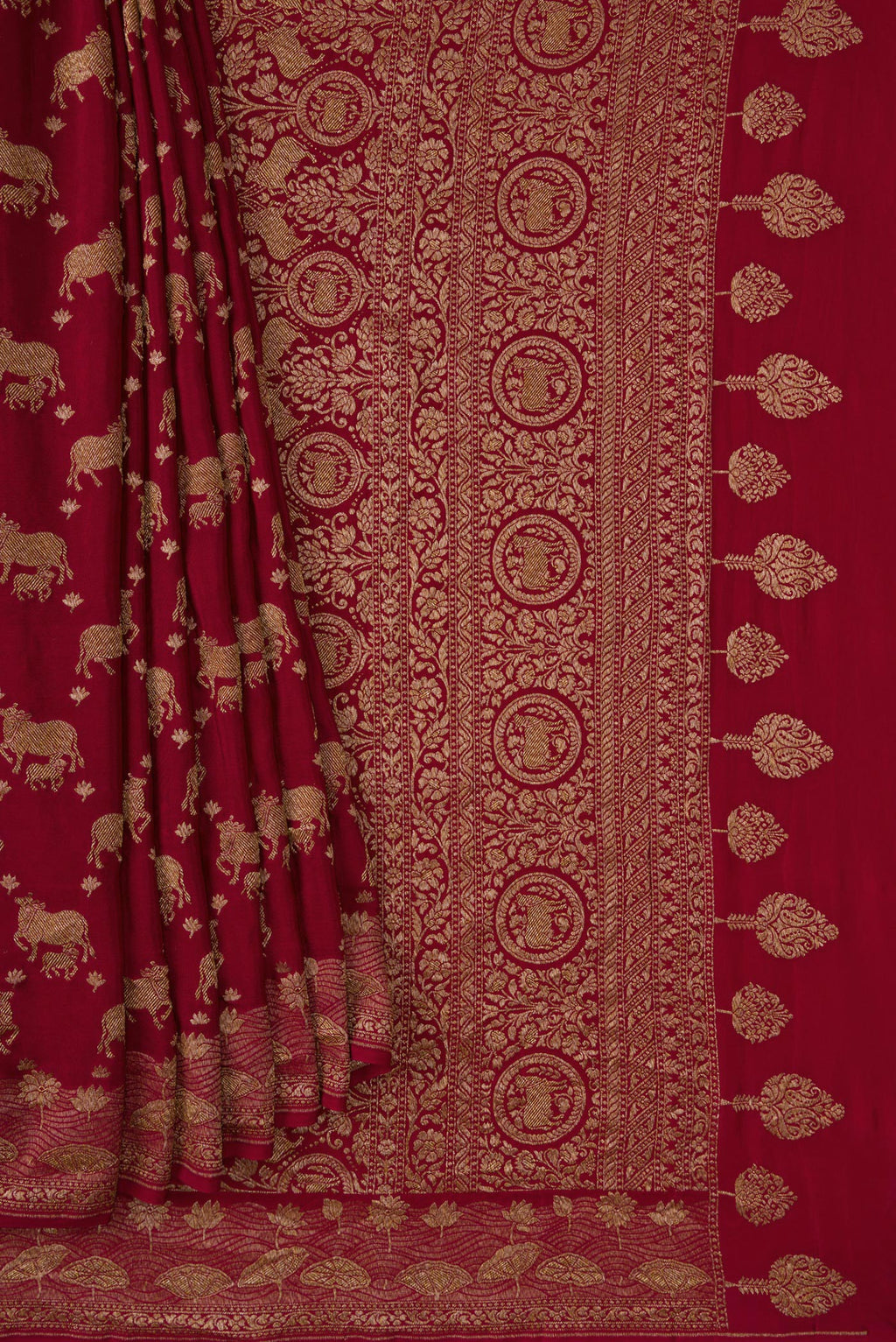 Pleats and pallu of Maroon Dual Tone Banarasi Georgette Saree with Zari Brocade on the body and Fancy Border. 
