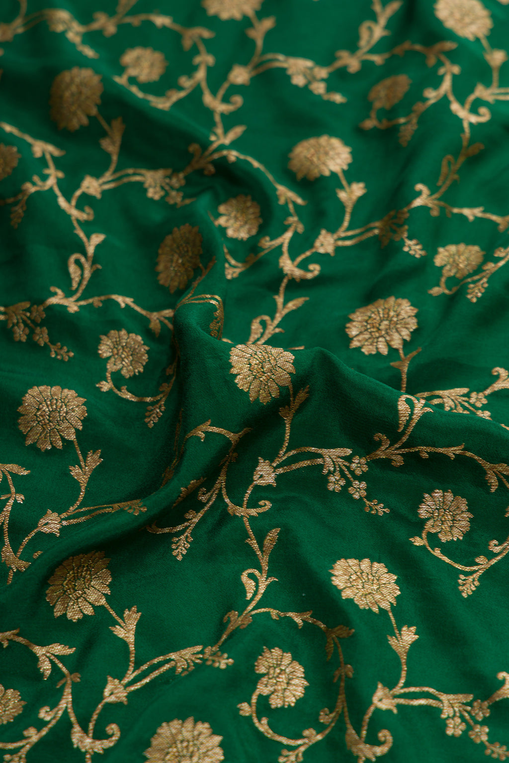 Close up of Bottle Green Dual Tone Mysore Georgette Saree with Zari Brocade on the body and Zari Border.  displaying folds