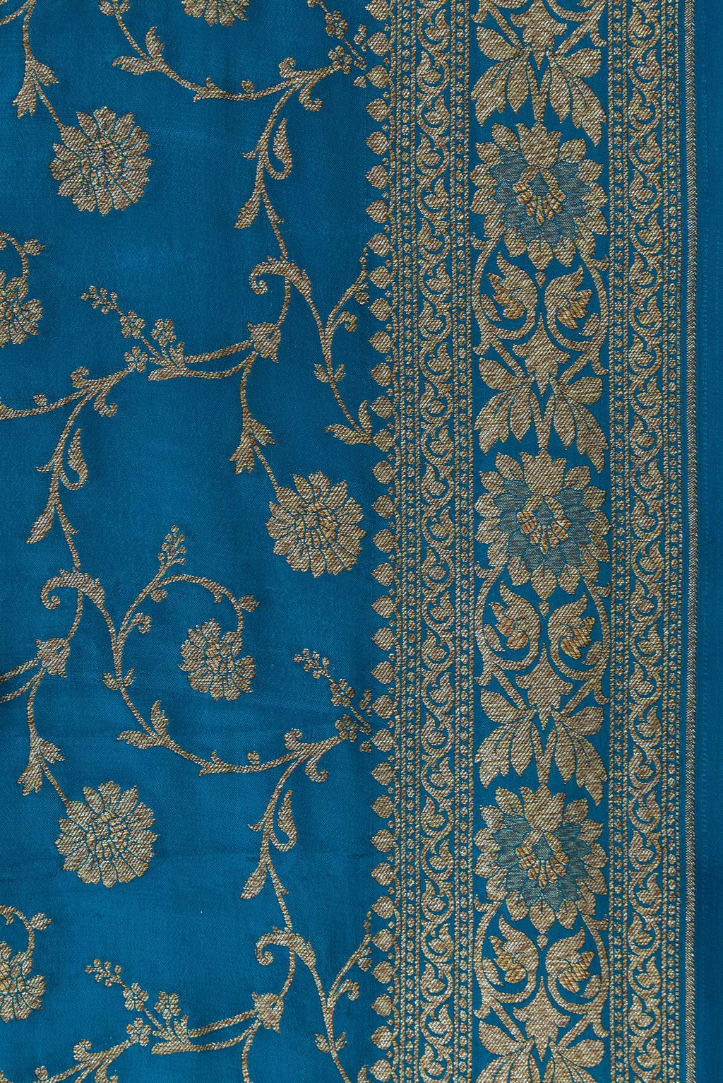 Border image of Peacock Blue Dual Tone Banarasi Georgette Saree with Zari Brocade on the body and Zari Border. 