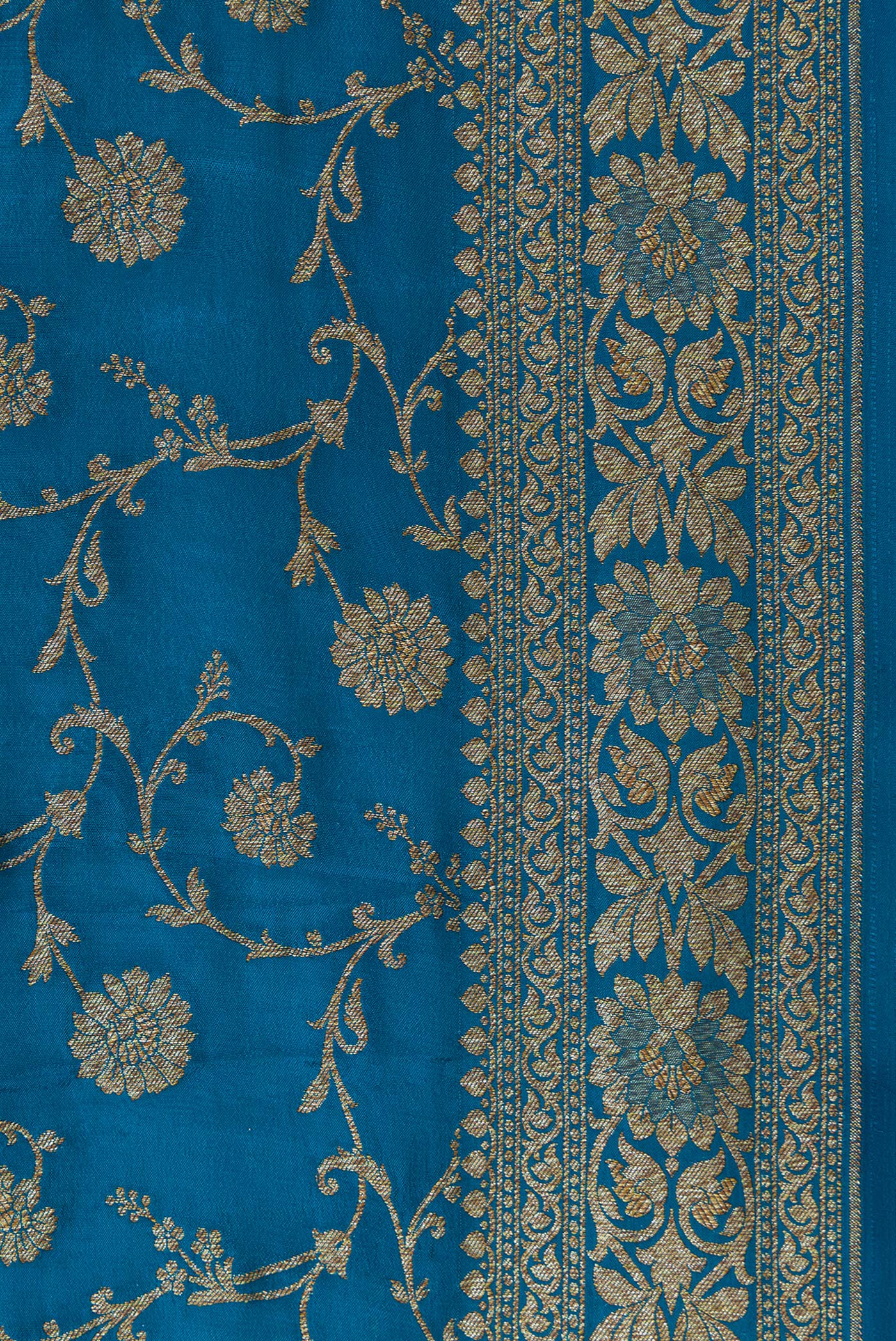 Border image of Peacock Blue Dual Tone Banarasi Georgette Saree with Zari Brocade on the body and Zari Border. 