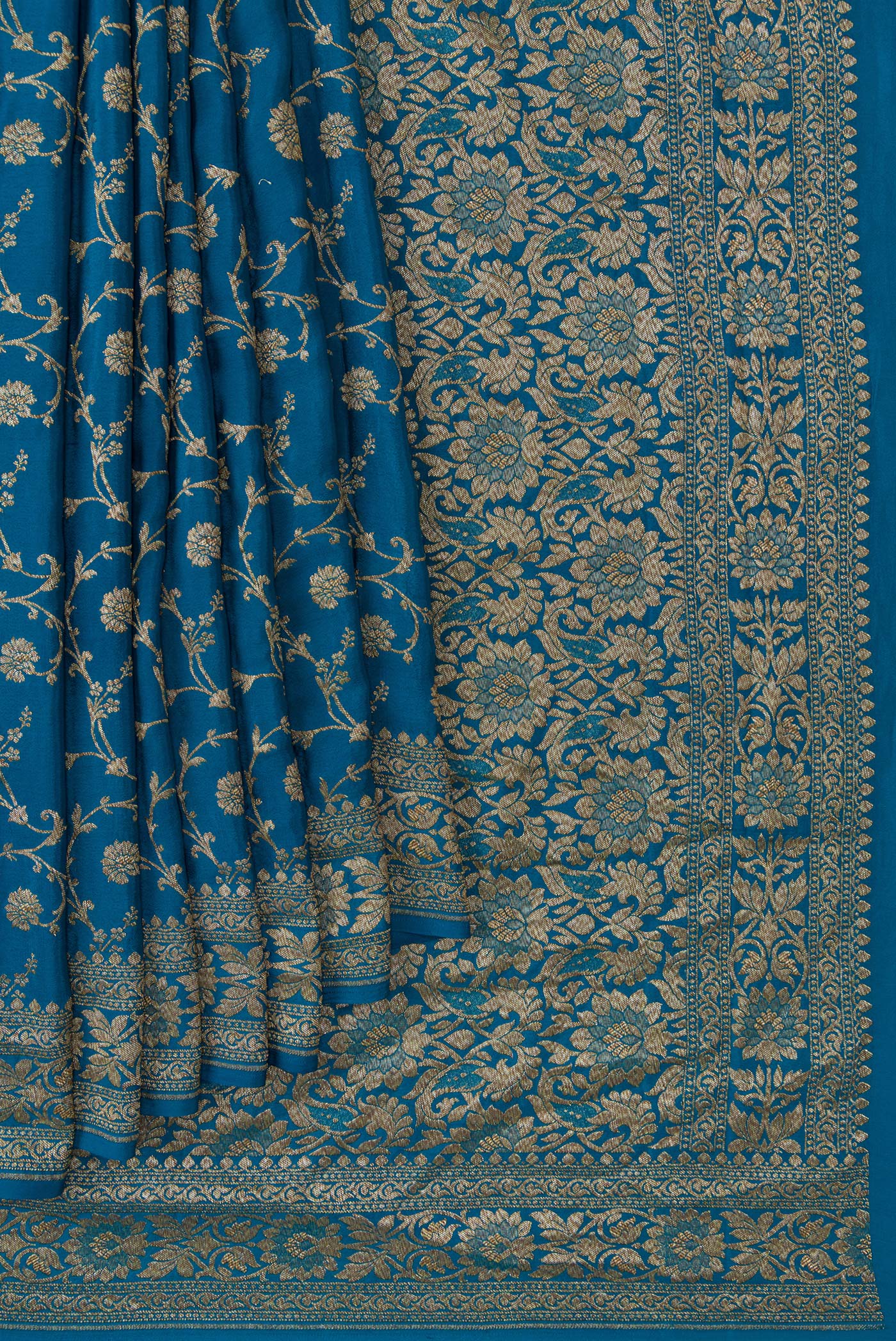 Pleats and pallu of Peacock Blue Dual Tone Banarasi Georgette Saree with Zari Brocade on the body and Zari Border. 