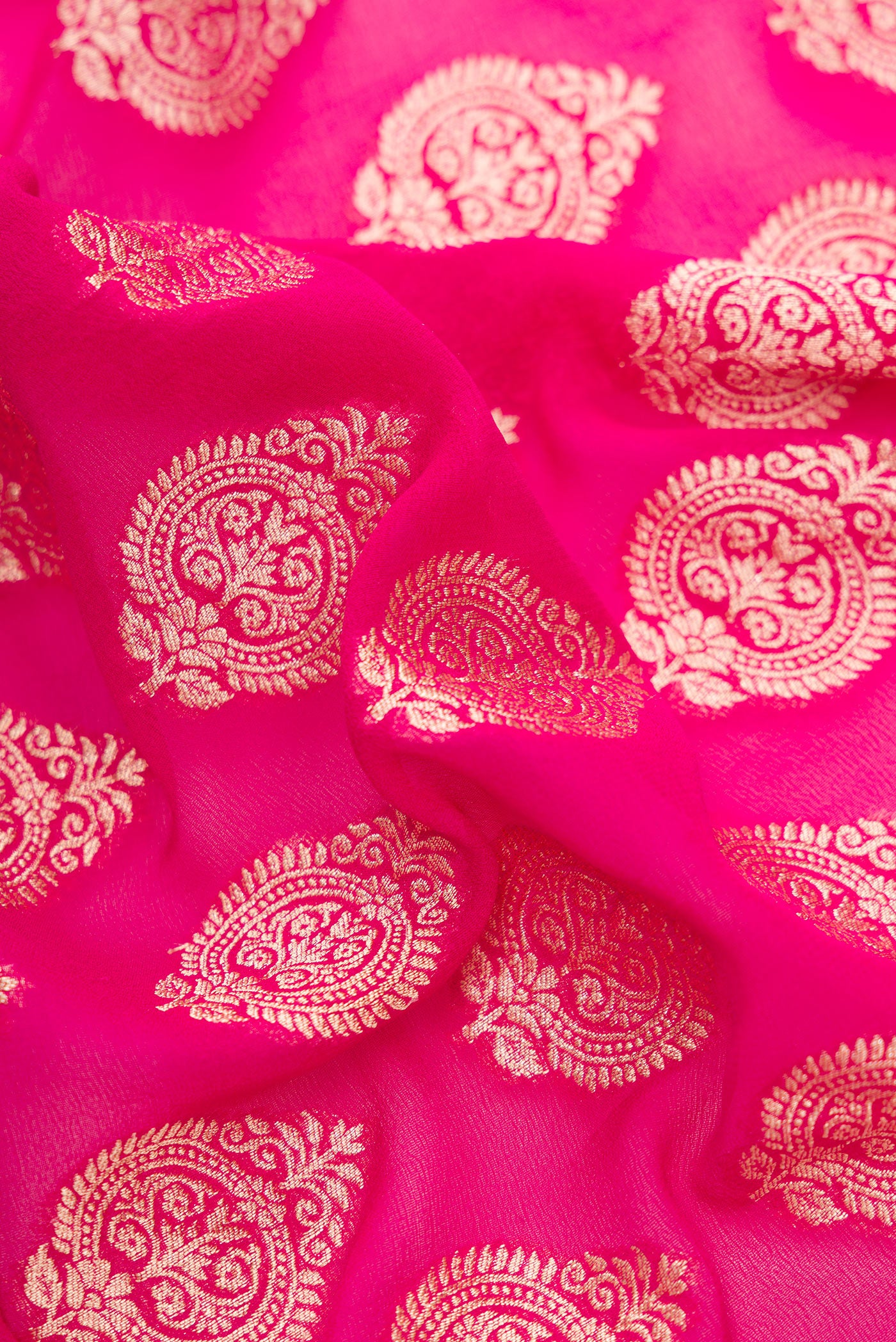 Close up of Pink Dual Tone Banarasi Georgette Saree with Zari Butta on the body and Zari Border.  displaying folds
