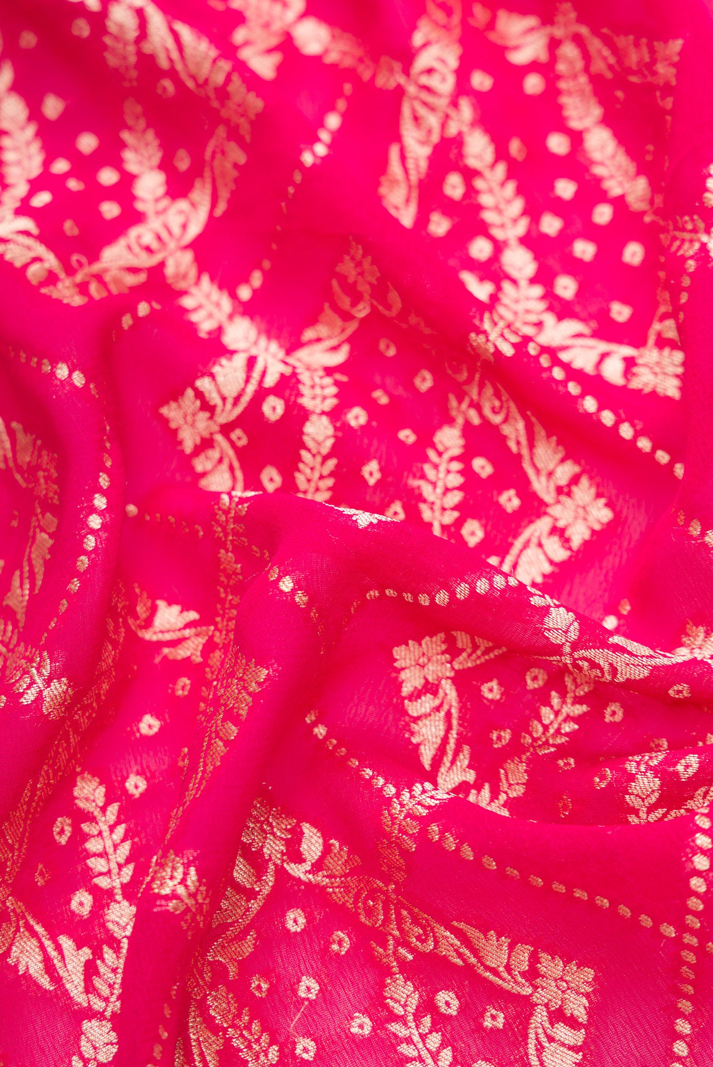 Close up of Pink Dual Tone Banarasi Georgette Saree with Zari Brocade on the body and Zari Border.  displaying folds