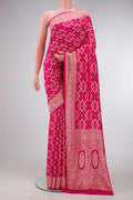 Pink Dual Tone Banarasi Georgette Saree with Zari Brocade on the body and Zari Border.  displayed on a mannequin