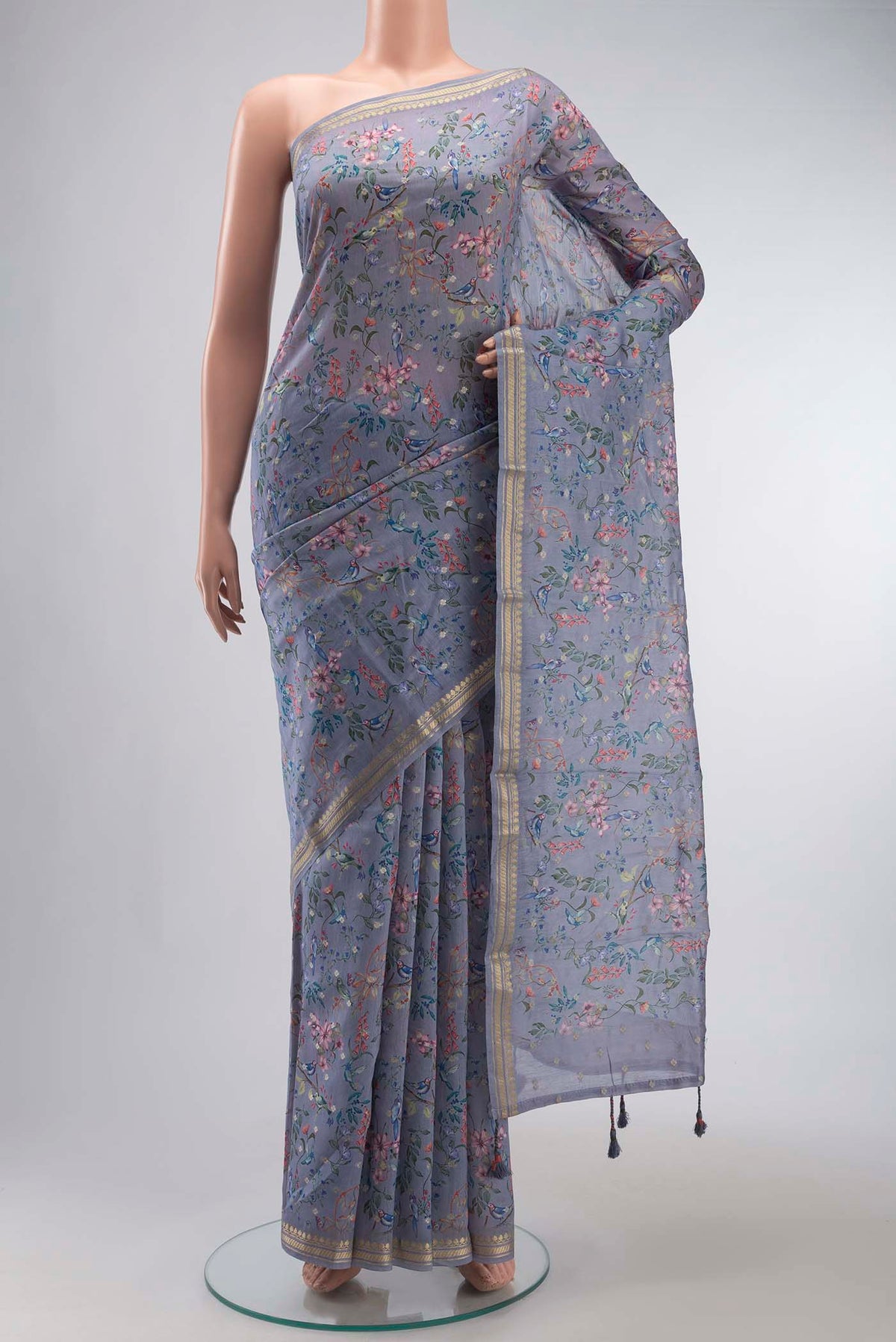 Blue Silk Cotton Saree with Printed design on the body and Zari Border displayed on a mannequin