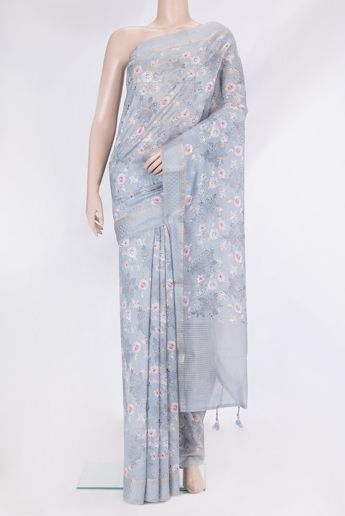Grey Chanderi Silk Cotton Saree with Printed design on the body and Zari And Thread Border.  displayed on a mannequin