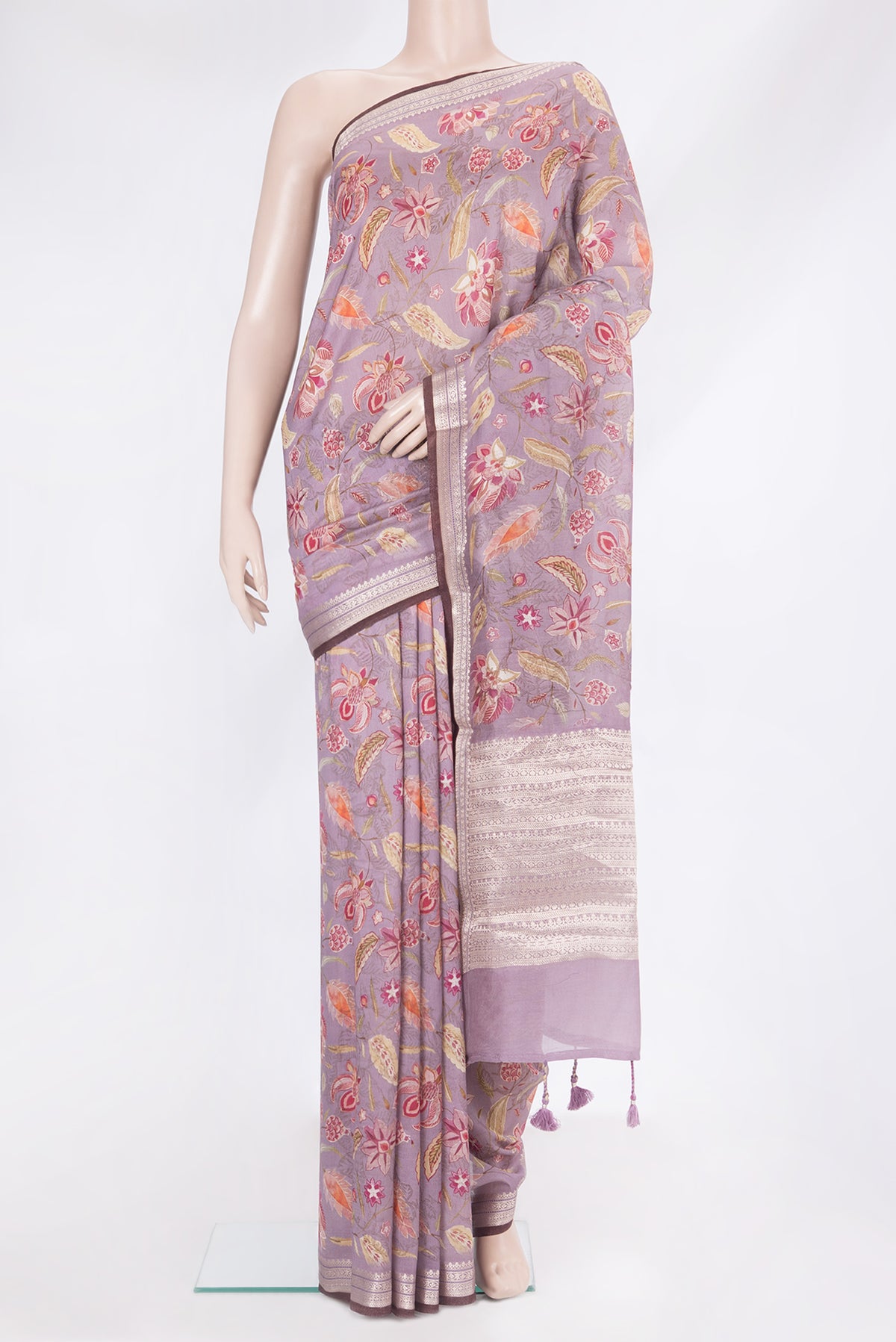 Lavender Chanderi Silk Cotton Saree with Printed design on the body and Zari Border.  displayed on a mannequin