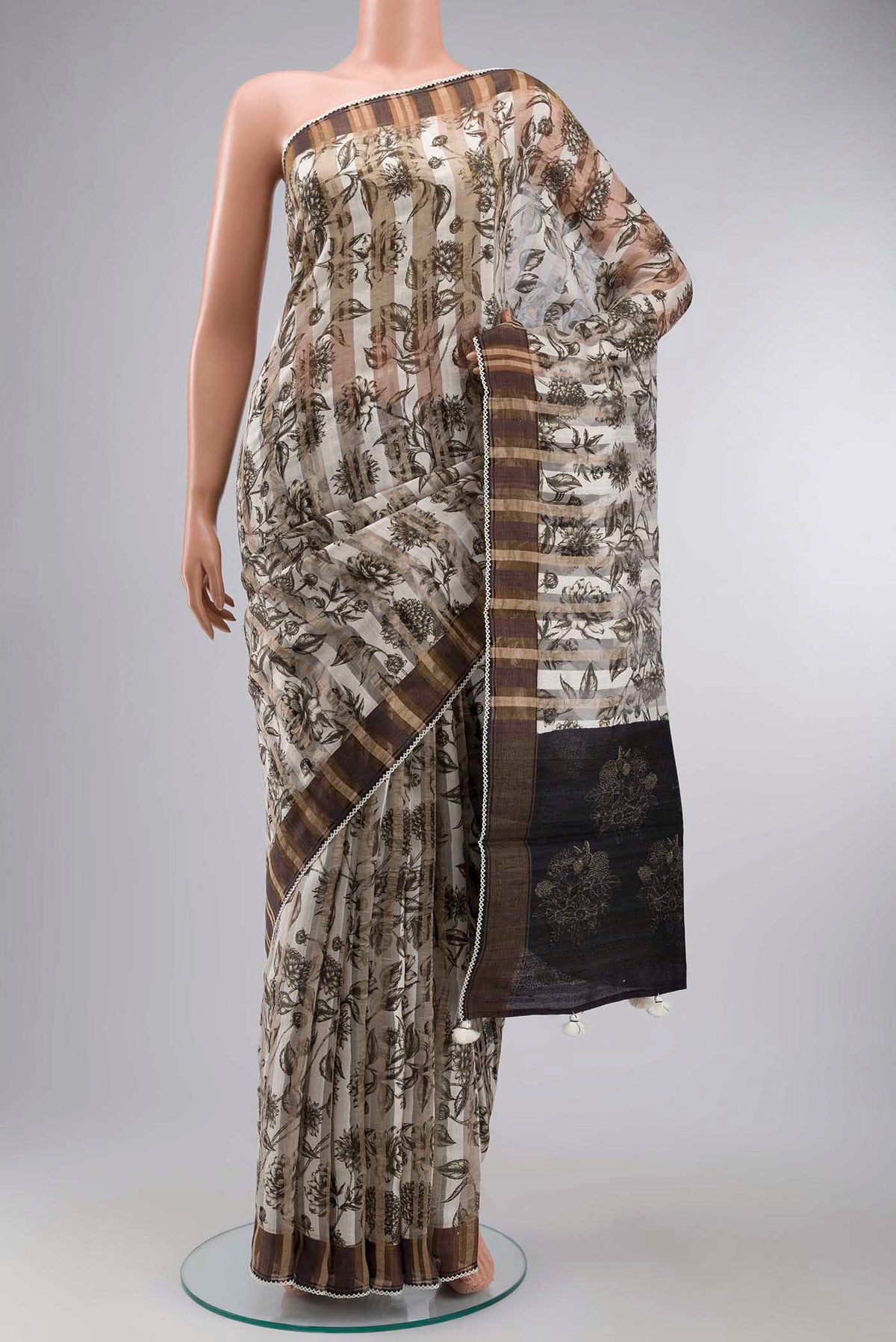 Cream Bhagalpuri Tussar Silk Saree with Printed design on the body and Zari Border displayed on a mannequin