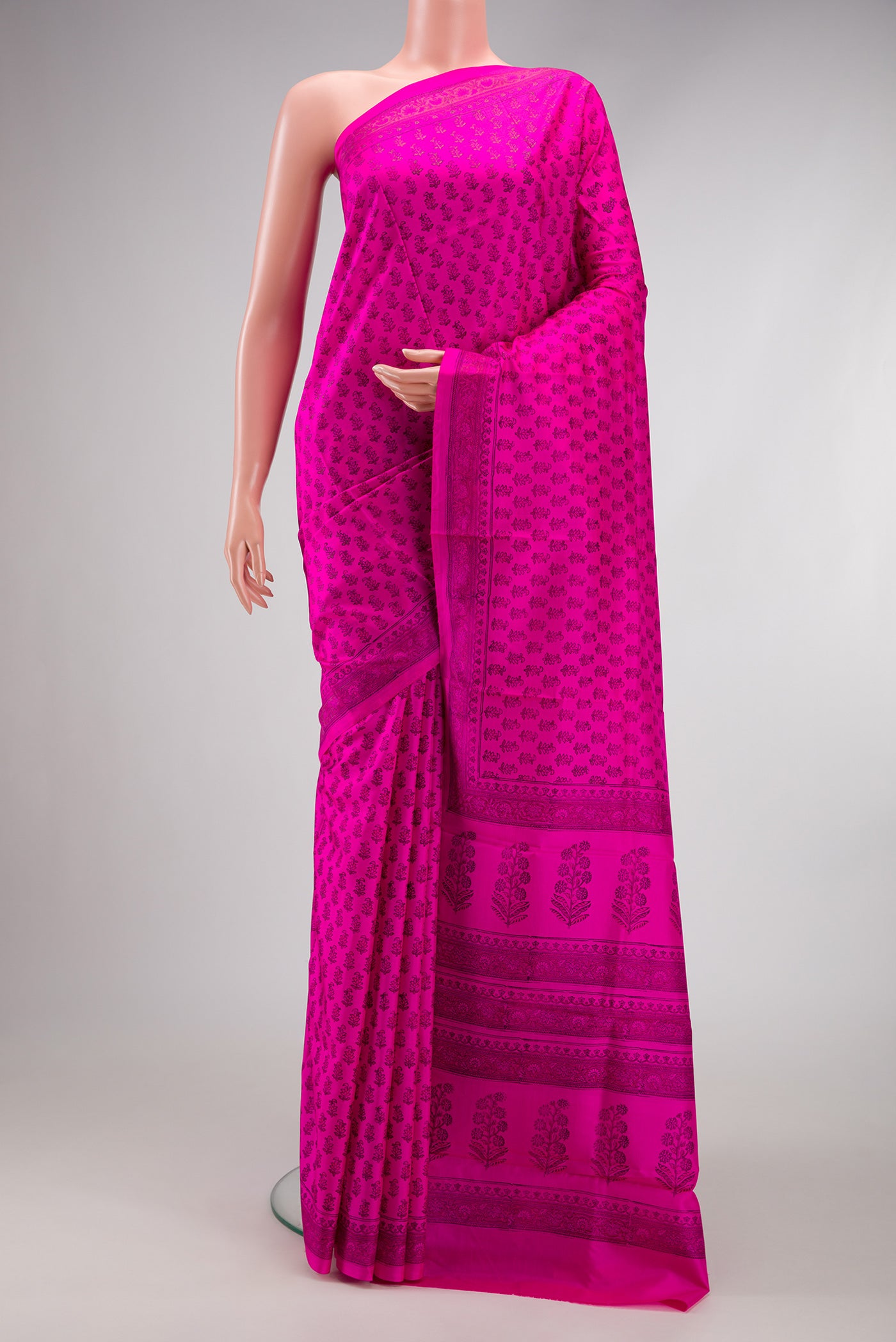 Dark Pink Dual Tone Printed Silk Saree with Printed design on the body and Printed Border.  displayed on a mannequin