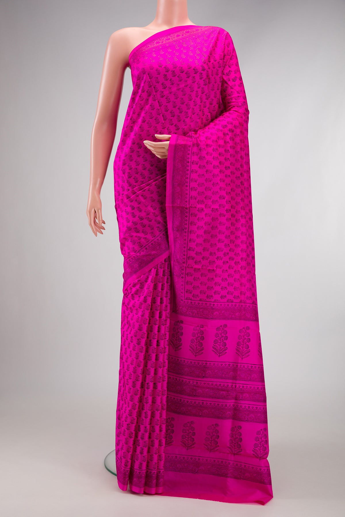 Dark Pink Dual Tone Printed Silk Saree with Printed design on the body and Printed Border.  displayed on a mannequin