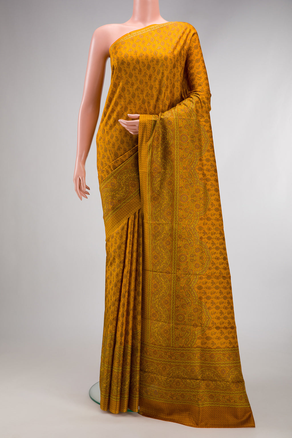 Mustard Dual Tone Printed Silk Saree with Printed design on the body and Printed Border.  displayed on a mannequin