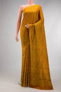 Mustard Dual Tone Printed Silk Saree with Printed design on the body and Printed Border.  displayed on a mannequin