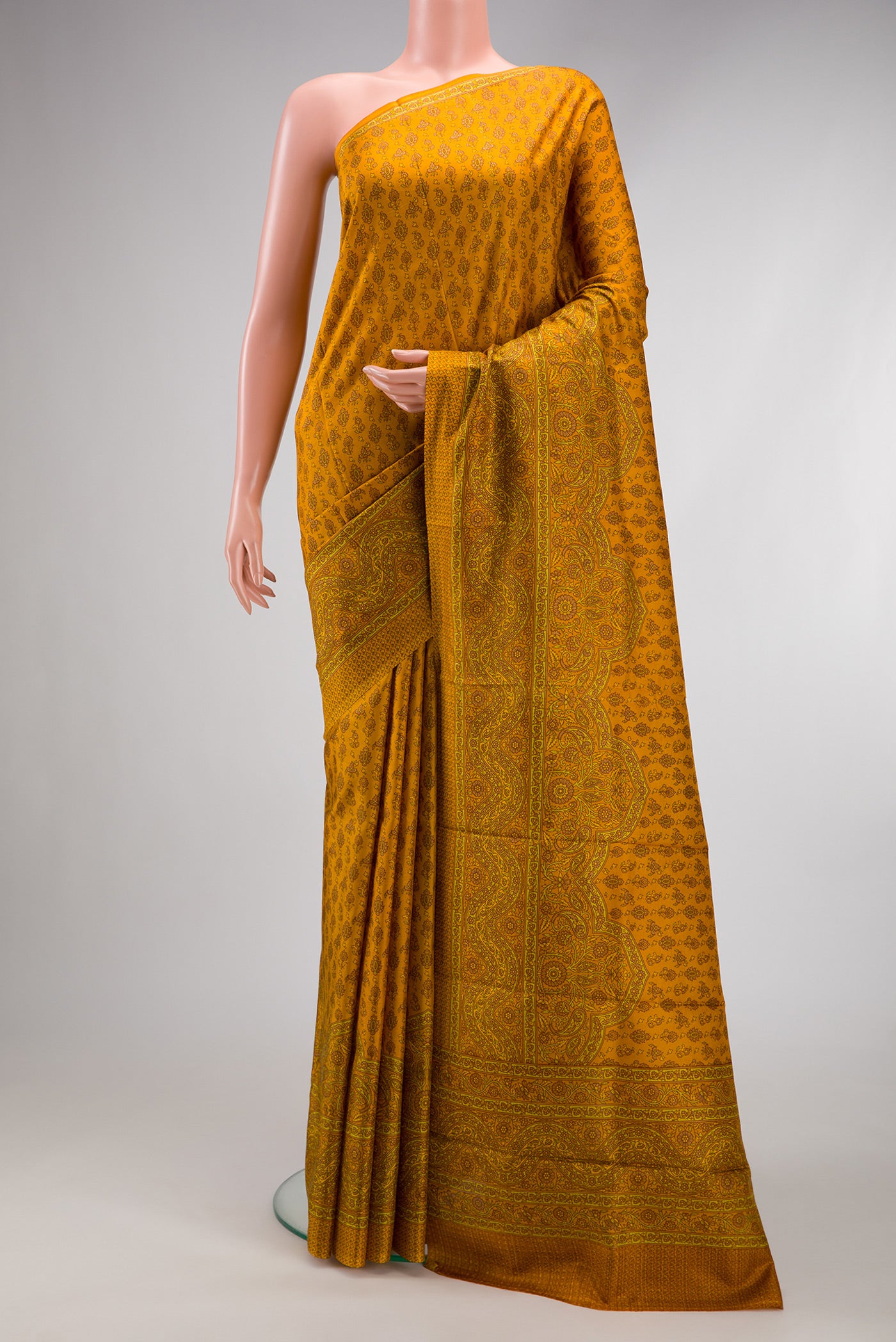 Mustard Dual Tone Printed Silk Saree with Printed design on the body and Printed Border.  displayed on a mannequin