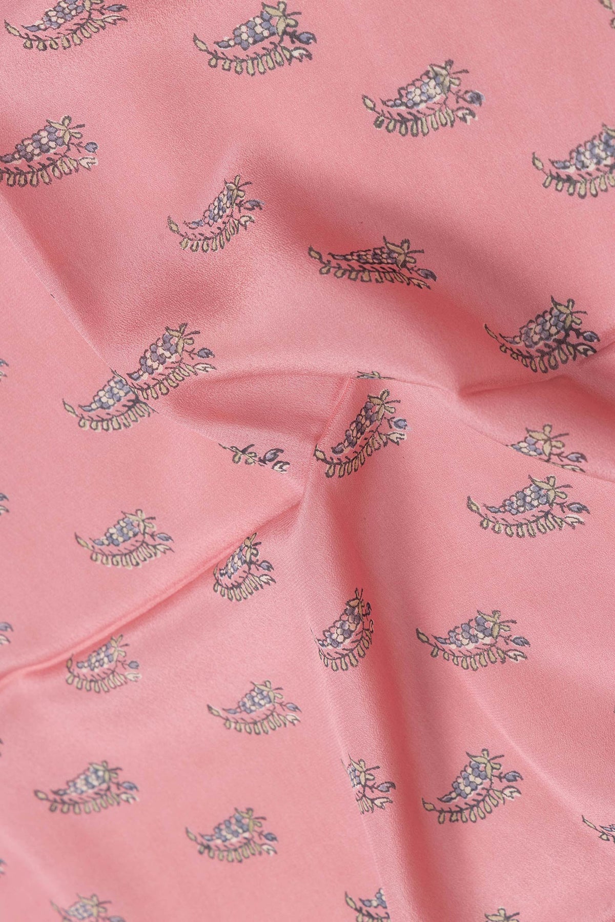 Close up of Pink Dual Tone Crepe Saree with Printed design on the body and Zari Border.  displaying folds