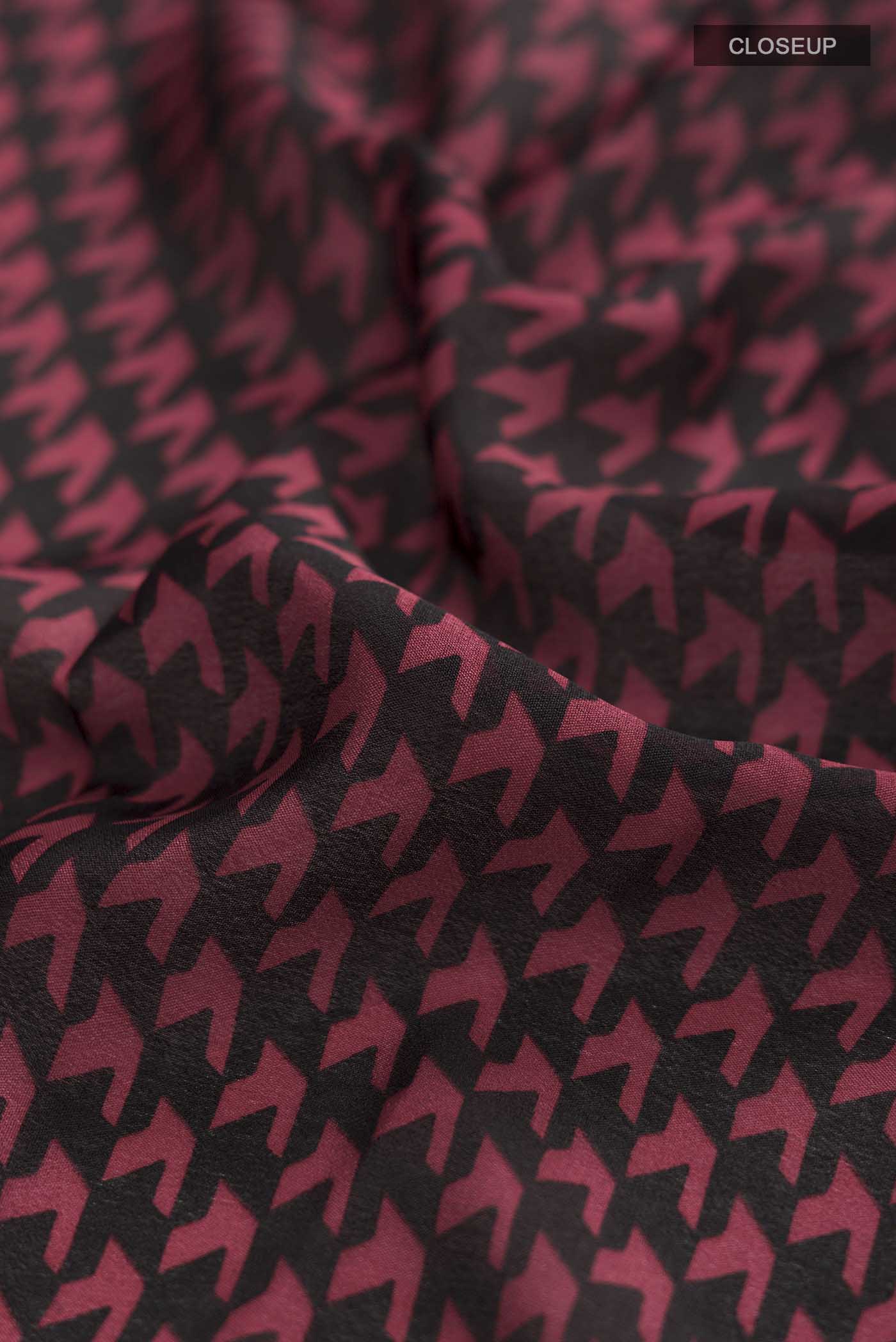 Close up of Black Mysore Crepe Saree with Printed design on the body and Thread Border displaying folds